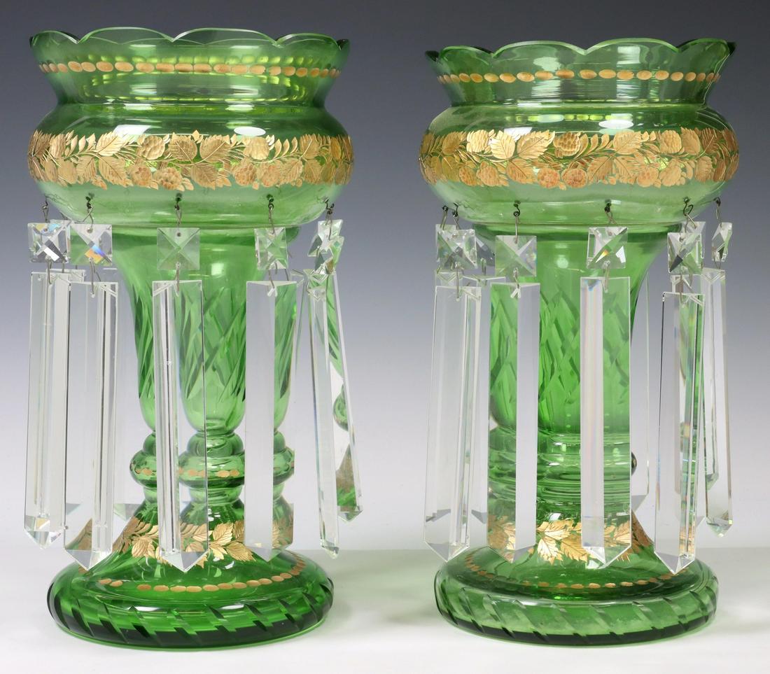 (2) EMERALD GREEN & PARCEL GILT MANTEL LUSTERS: (pair) Emerald green and parcel gilt glass mantle lusters, having scalloped rim, over gilt foliate accents, twist standard, hung with crystal prisms, rising on round cut base, accompanied by four addi
