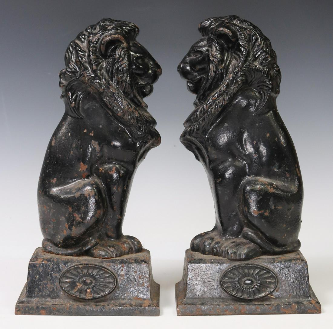 (2) CAST IRON SEATED LION DOOR STOPS/ PORTERS (1 of 3)