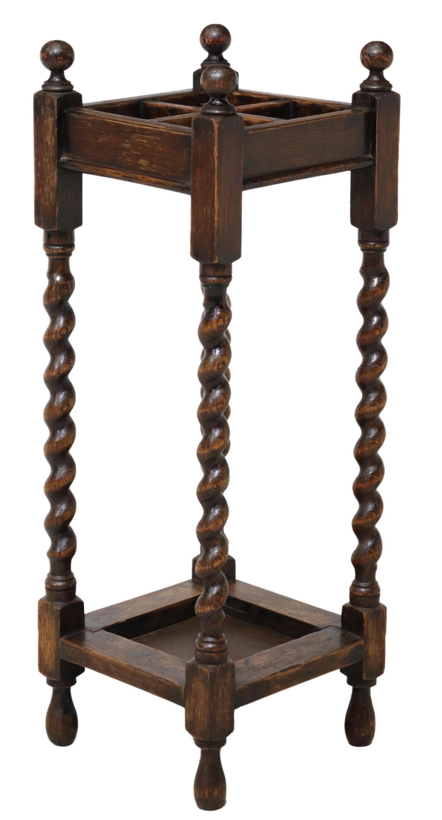 ENGLISH OAK BARLEY TWIST UMBRELLA OR STICK STAND: English oak umbrella or stick stand, early 20th c., four sections, barley twist supports, approx 28"h, 9.75"w, 9.75"d Start Price: $60.00