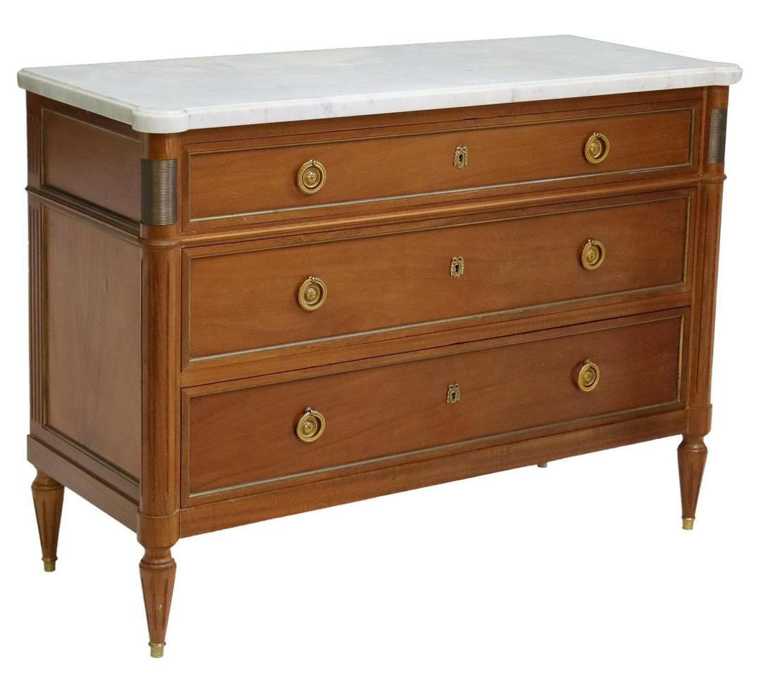 FRENCH LOUIS XVI STYLE MARBLE-TOP MAHOGANY COMMODE: French Louis XVI style marble-top mahogany commode, 20th c., three drawers flanked by fluted corner posts, rising on tapered legs, approx 35"h, 48"w, 19.5"d Start Price: $400.00