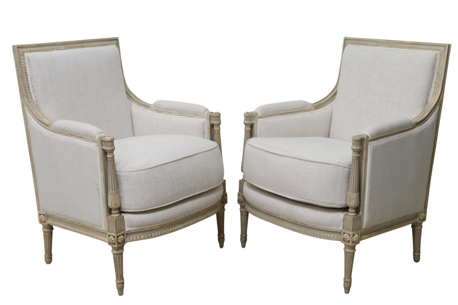 (2) LOUIS XVI STYLE LINEN UPHOLSTERED BERGERES: (pair) Contemporary Louis XVI style armchairs, having carved running ornamentation trim, in linen upholstery, with removable seat cushion, rising on fluted and tapered legs, ending on blunt arrow feet