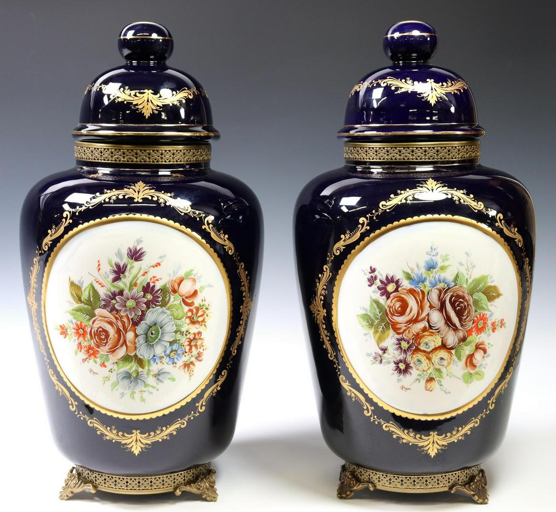 (2) SEVRES STYLE GILT PORCELAIN VASES & COVERS: (pair) Sevres style parcel gilt porcelain vases and covers, cobalt-glazed ground, reserve with floral spray, marked underfoot Kobalt K Stile Sevres, approx 20"h, 10"diam; 18lbs total **Provenance: Fro