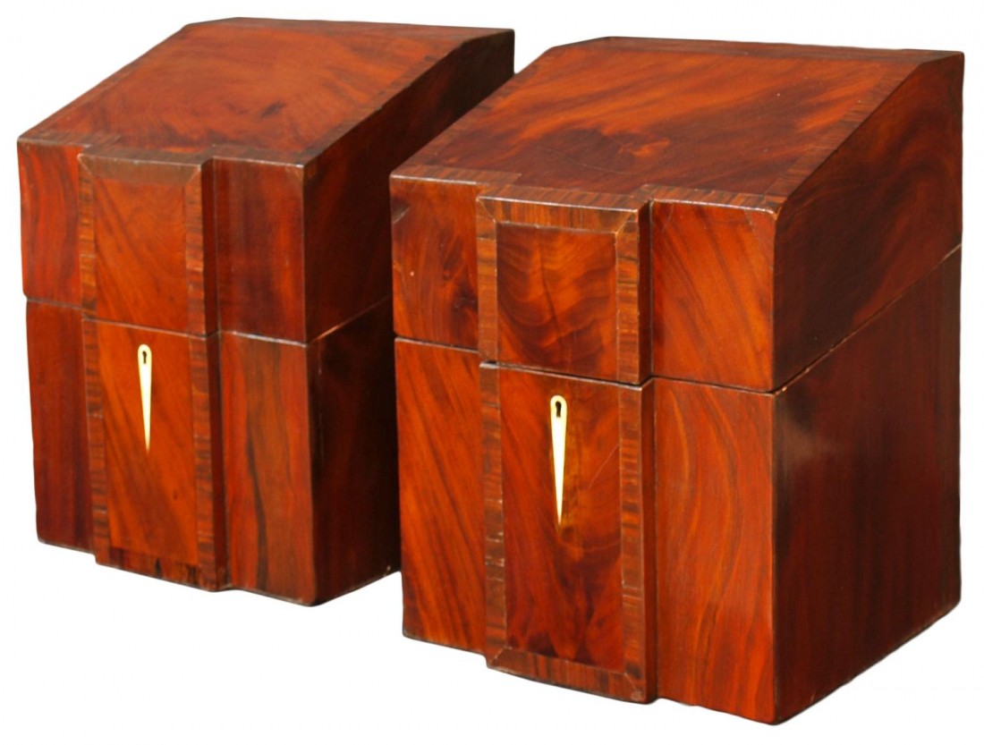 (PAIR) GEORGIAN MAHOGANY KNIFE BOXES: (pair) Georgian cross banded mahogany knife boxes, c. 1800, the slant lids above shaped breakfronts with bone inlaid escutcheons, interior fitted with slots, 15.5"h, 11.5"w, 10.5"d, Start Price: $400.