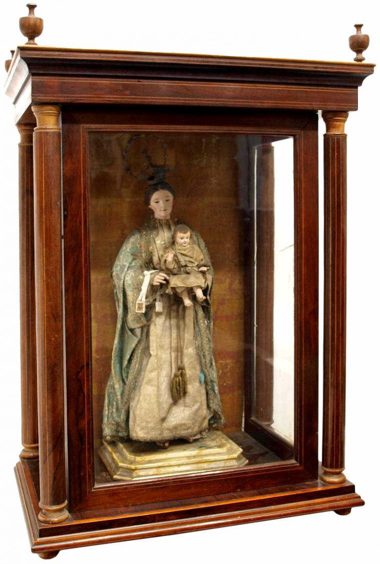 ANTIQUE RELIGIOUS SPAIN CABINET & FIGURAL GROUP: (lot ) Northern Spain capilla display cabinet holding a religious carved wood figural group, Barcelona, c. 1880, comprising: A remarkable carved wood statuary group, the Madonna and Christ Child, each