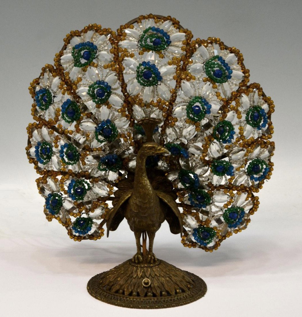 CZECH ART DECO BEADED PEACOCK LAMP: Czech art glass peacock three light table lamp,early 20th c., depicted as a heavy patinated brass peacock with tail feathers of multi color glass beads, 16.25"h, 15"w, 6"d, 8.5lbs Start Price: $400.00