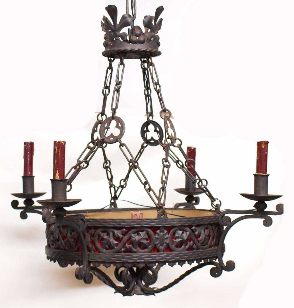 ANTIQUE NORTHERN SPAIN WROUGHT IRON CHANDELIER: Wrought iron five-light chandelier in the Baroque taste, Spain, 19th c., a converted candelier having foliated pierced central ring holding four four arms, each terminating a light, single light at ce