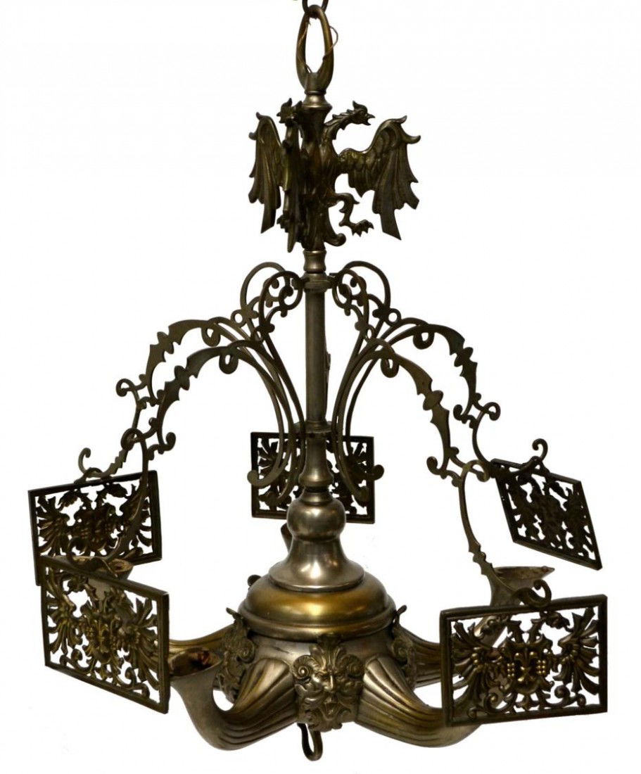 ANTIQUE GRIFFIN FIGURAL WHALE OIL CHANDELIER,SPAIN: Antique Spanish hanging whale oil chandelier in a silver tone finish, winged griffins surmounting five scrolled arms hung with pierced light deflectors, five arms spaced by figural masks, evidence of