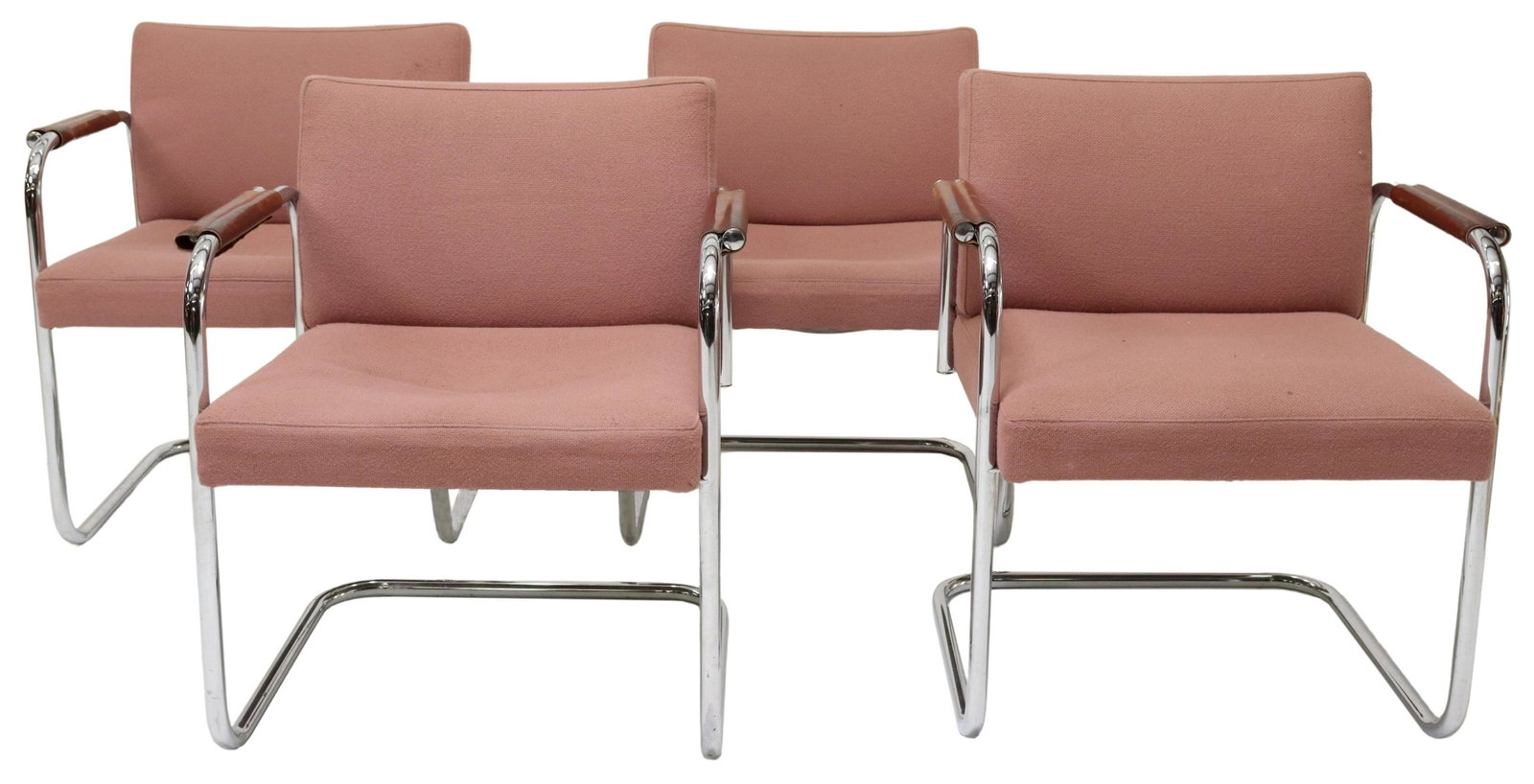 (4) MID-CENTURY CANTILEVER CHROMED STEEL ARMCHAIRS: (lot of 4) Mid-century modern upholstered cantilever armchairs, c.1950s, having tubular chromed steel frame, padded back and seat in pink fabric upholstery, with tan leather armrests, approx 30"h, 26"
