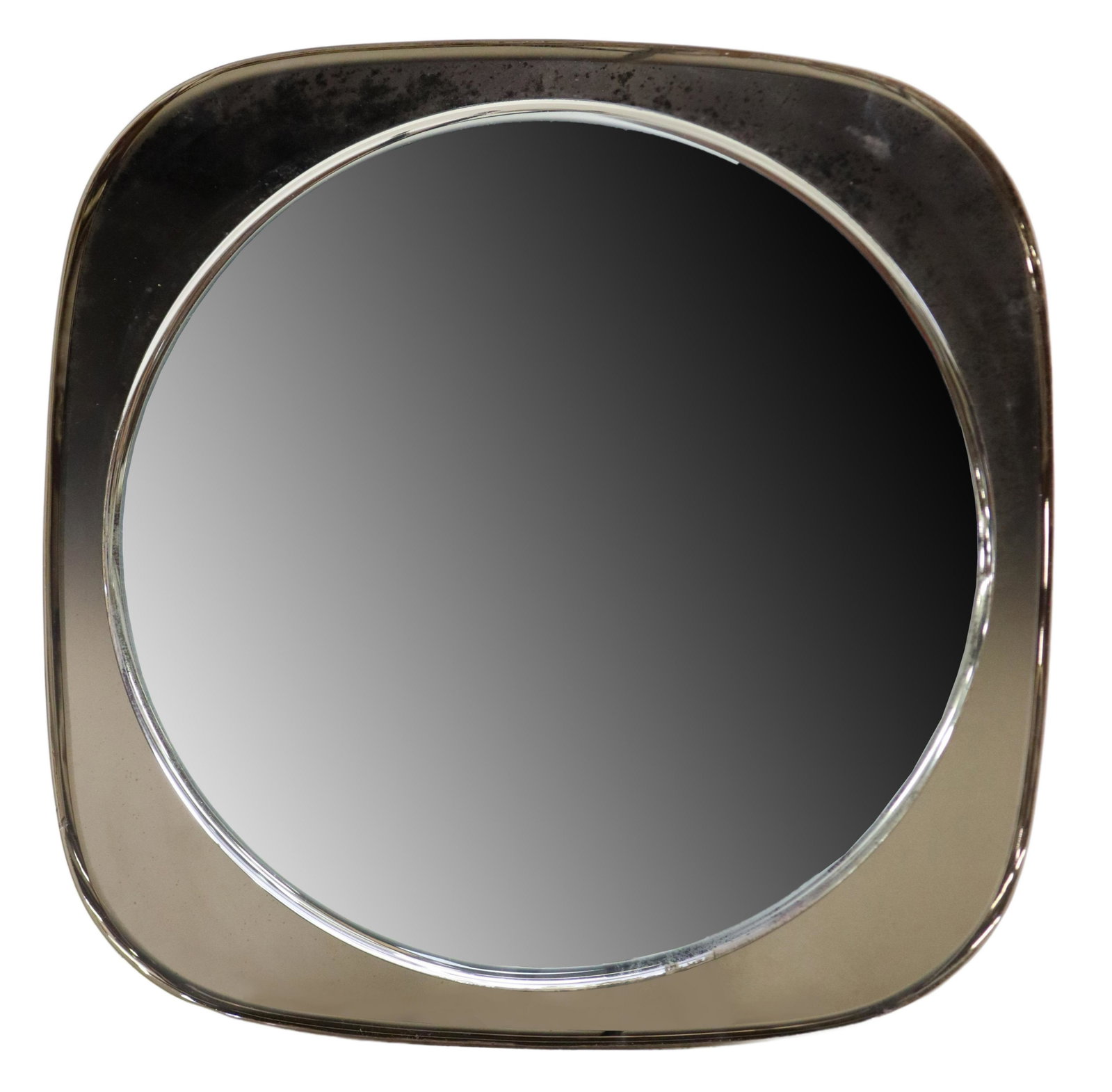 ITALIAN MID-CENTURY MODERN SMOKE GLASS WALL MIRROR: Italian mid-century modern bathroom wall mirror, in the manner of Fontana Arte, c.1960s, having shaped smoke glass frame, centering round beveled mirror plate, approx 31.25"sq, 35.25lbs Start Price: $