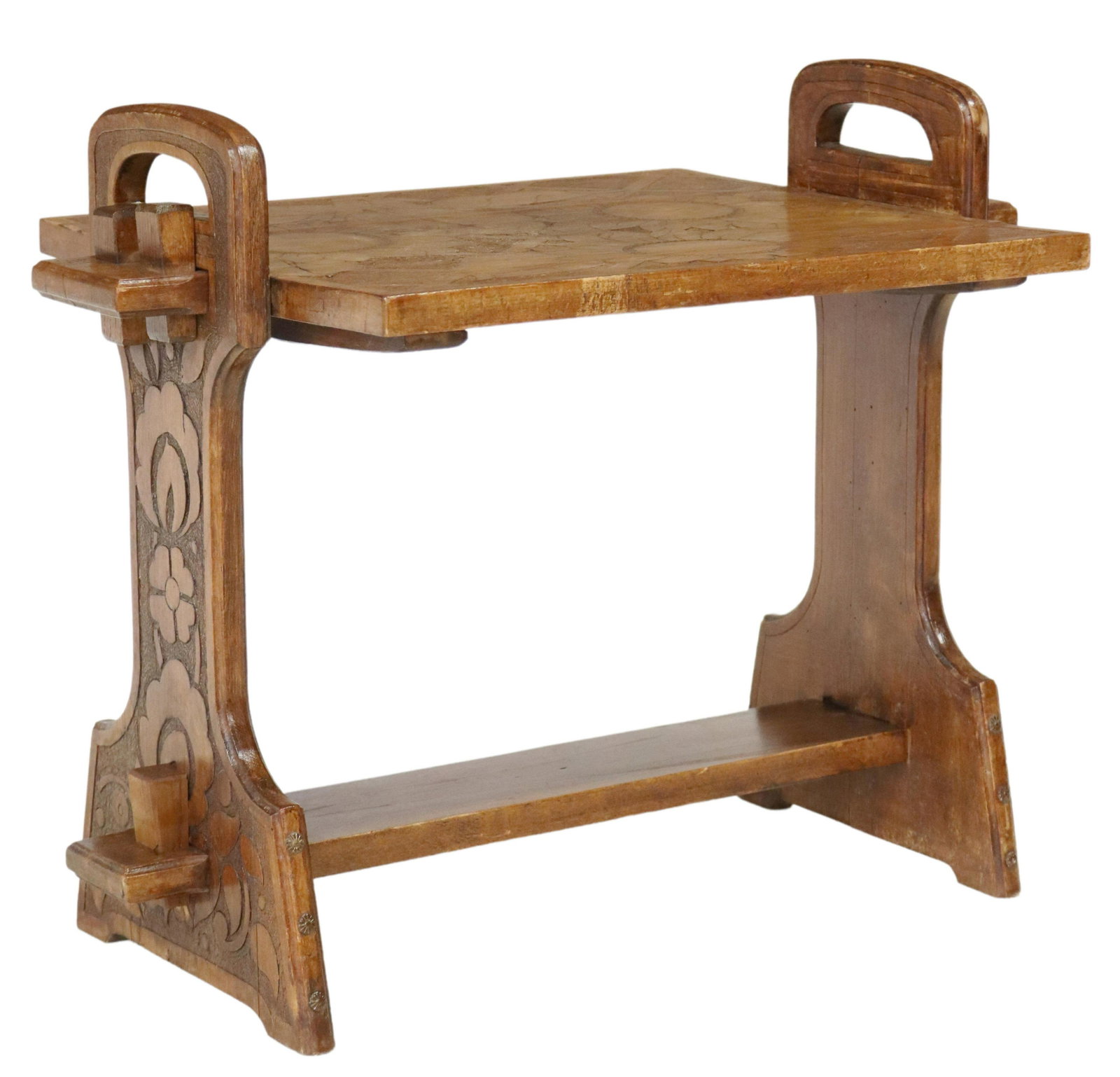 ART NOUVEAU CARVED TRESTLE SIDE TABLE: Art Nouveau side table, early 20th c., tabletop carved with sunflowers, cross stretcher with wedged mortise and tenon joinery, approx 21"h, 25.5"w, 17.25"d Start Price: $150.00