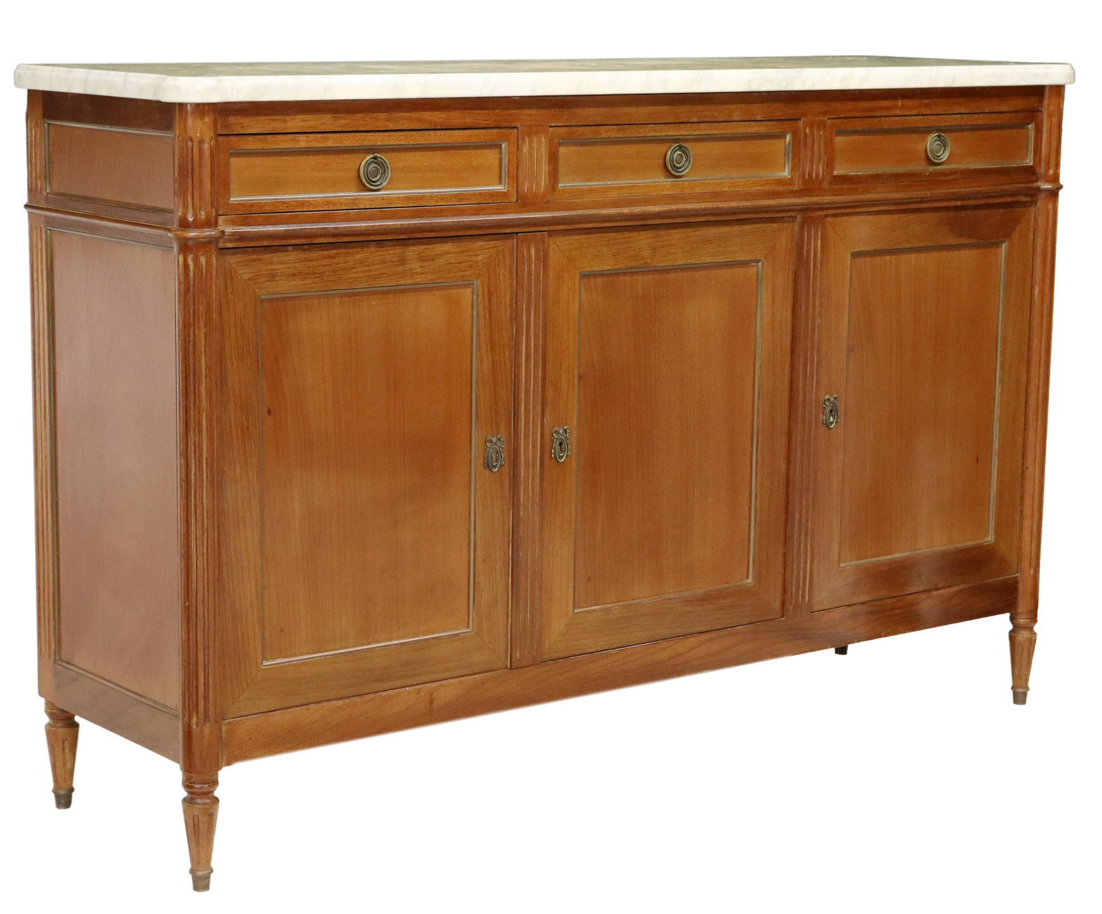 LOUIS XVI STYLE MARBLE-TOP MAHOGANY SIDEBOARD: Louis XVI style mahogany sideboard, 20th c., having shaped marble top, three drawers, over three cabinets, with gilt metal banding, rising on fluted and tapered legs, yellowing to marble top, approx 4