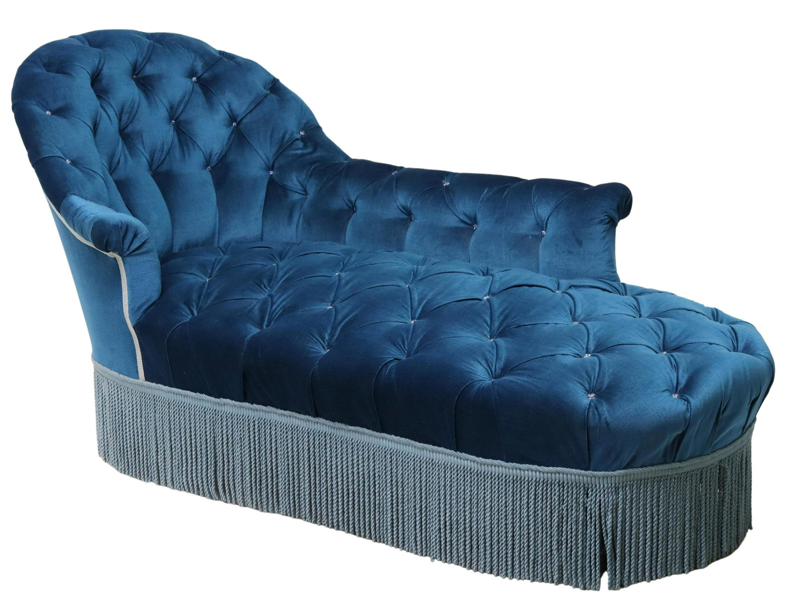 NAPOLEON III PERIOD BUTTON-TUFTED CHAISE LOUNGE: Napoleon III period chaise lounge, late 19th c., in blue button-tufted upholstery, over rope fringe, rising on turned legs, ending on casters, approx 33.75"h, 64"w, 32"d, seat height: 15.5"h Start Pri