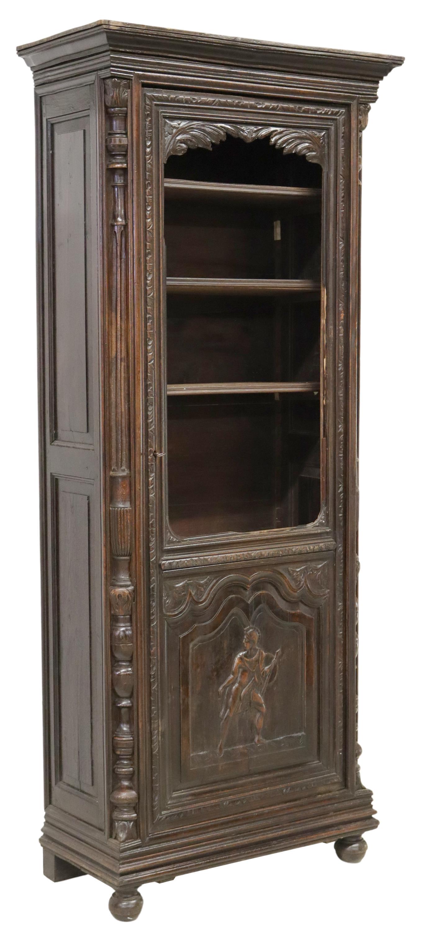 FRENCH CARVED CABINET/ BONNETIERE: French cabinet/ bonnetiere, 19th c., molded cornice, turned pilasters, single cabinet door carved with a Greek soldier, interior shelves, rising on bun feet, door lacking glass pane, approx 79.5"h, 34