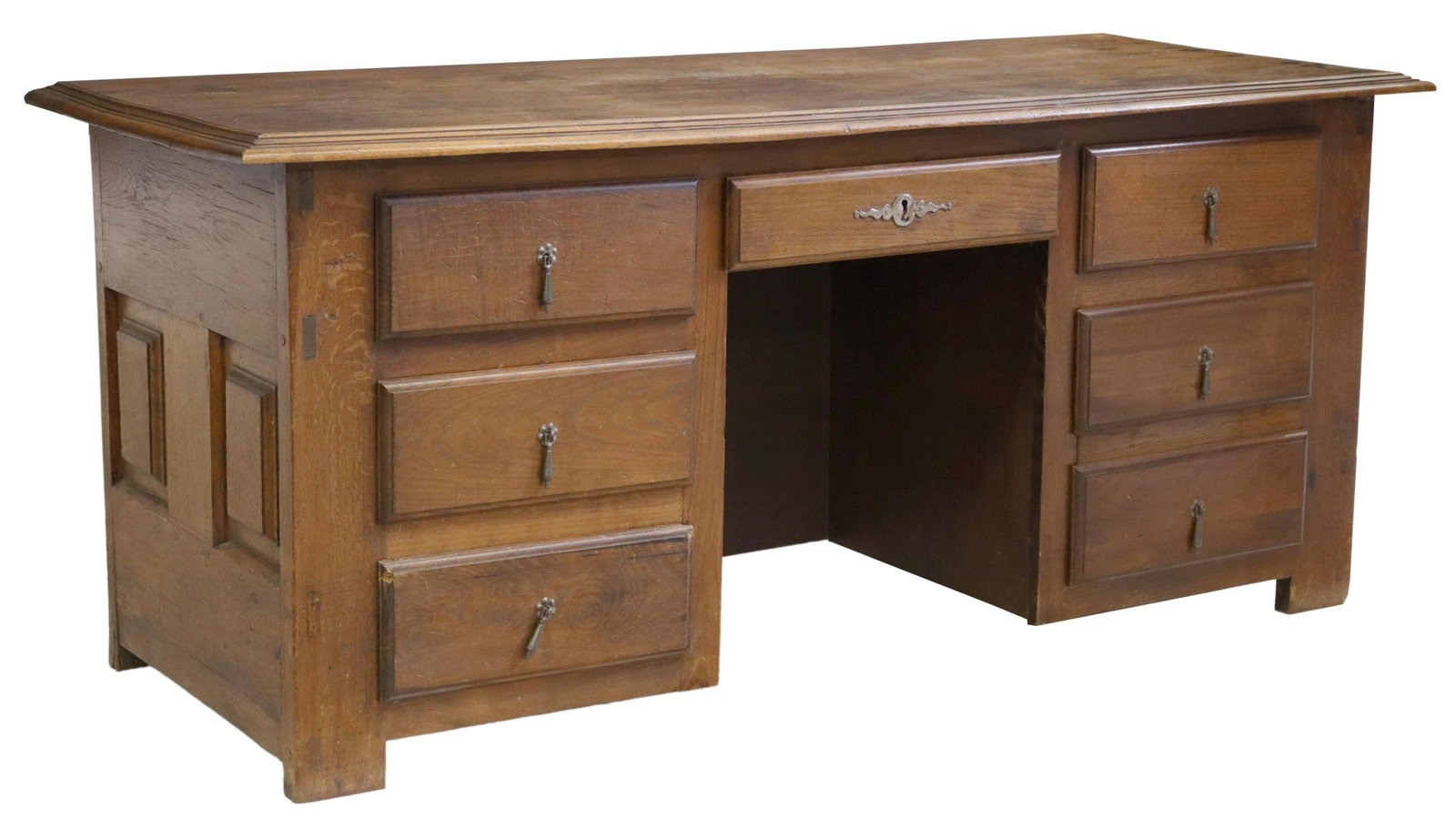 FRENCH OAK COFFER FASHIONED AS A WRITING DESK: French oak coffer, 19th c., now fashioned as a writing desk, six drawers flanking the center kneehole, reverse with geometric paneling, approx 31.5"h, 71.5"w, 28.75"d Start Price: $150.00