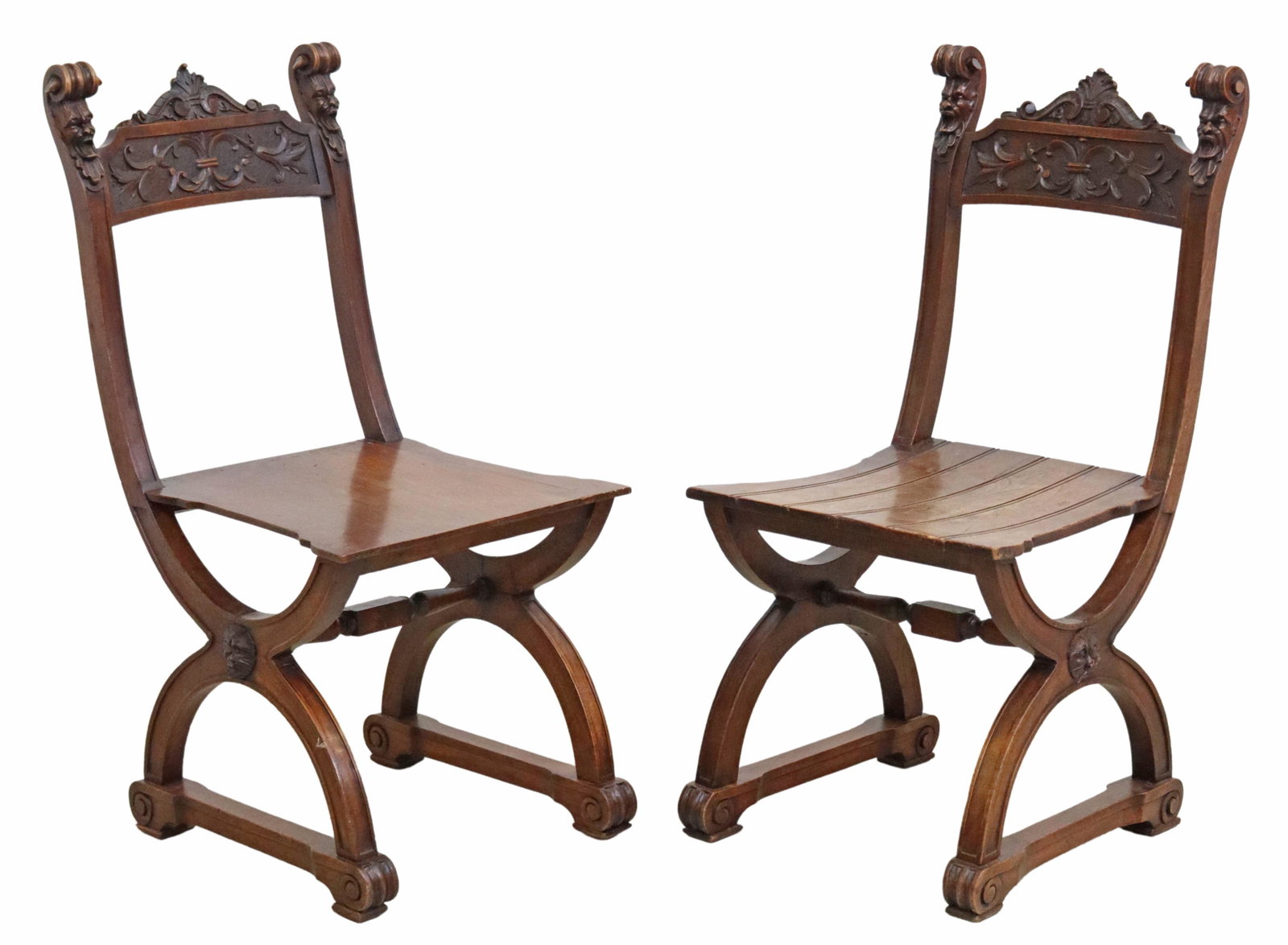 (2) FRENCH RENAISSANCE REVIVAL WALNUT SIDE CHAIRS: (pair) French Renaissance Revival walnut side chairs, late 19th c., scrolled grotesque mask finials, centering carved foliate crest, shaped seats in a slightly varied design, rising on curule base, jo