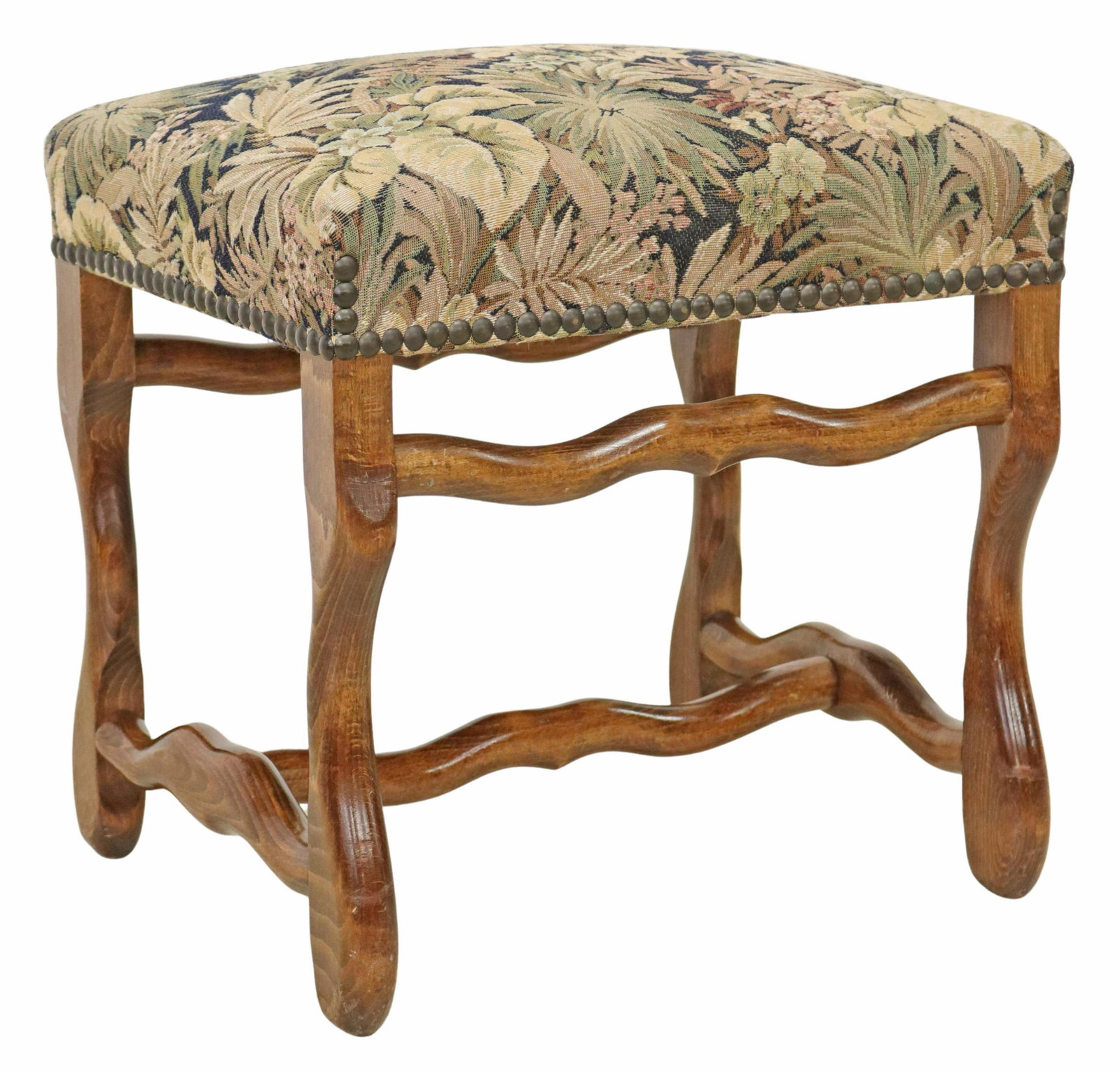 FRENCH LOUIS XIV STYLE UPHOLSTERED FOOTSTOOL: French Louis XIV style footstool, 20th c., floral tapestry style upholstered seat, with nailhead trim, rising on stretcher-joined volute legs, approx 19.25"h, 19"w, 15.75"d Start Price: $100.00