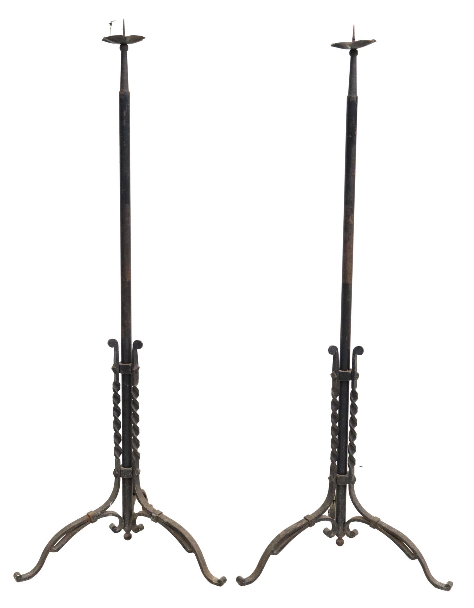 (2) WROUGHT IRON STANDING CANDLE PRICKETS: (pair) Wrought iron standing candle prickets, 20th c., having shaped bobeche, over cylindrical standard, rising on twisted and scrolled tripartite base, approx 53"h, 21"w, 21"d Start Price: $100.00