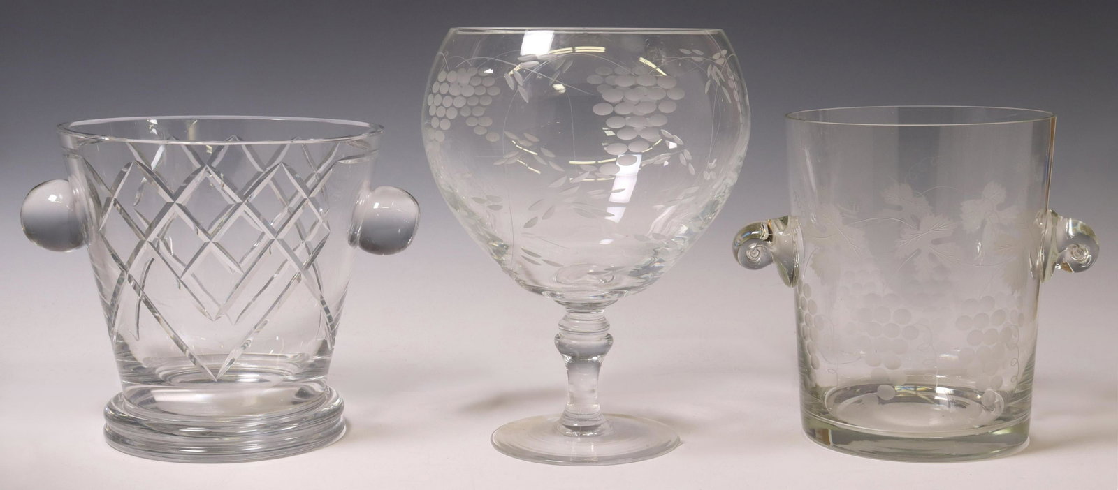 (3) CRYSTAL CHAMPAGNE COOLERS & OVERSIZED GOBLET: (lot of 3) Crystal tableware, 20th c., including: (1) French Cristal D'Argental champagne/ wine bottle cooler, (1) champagne/ wine cooler with etched grapevine motif, (1) oversized goblet, small chip 