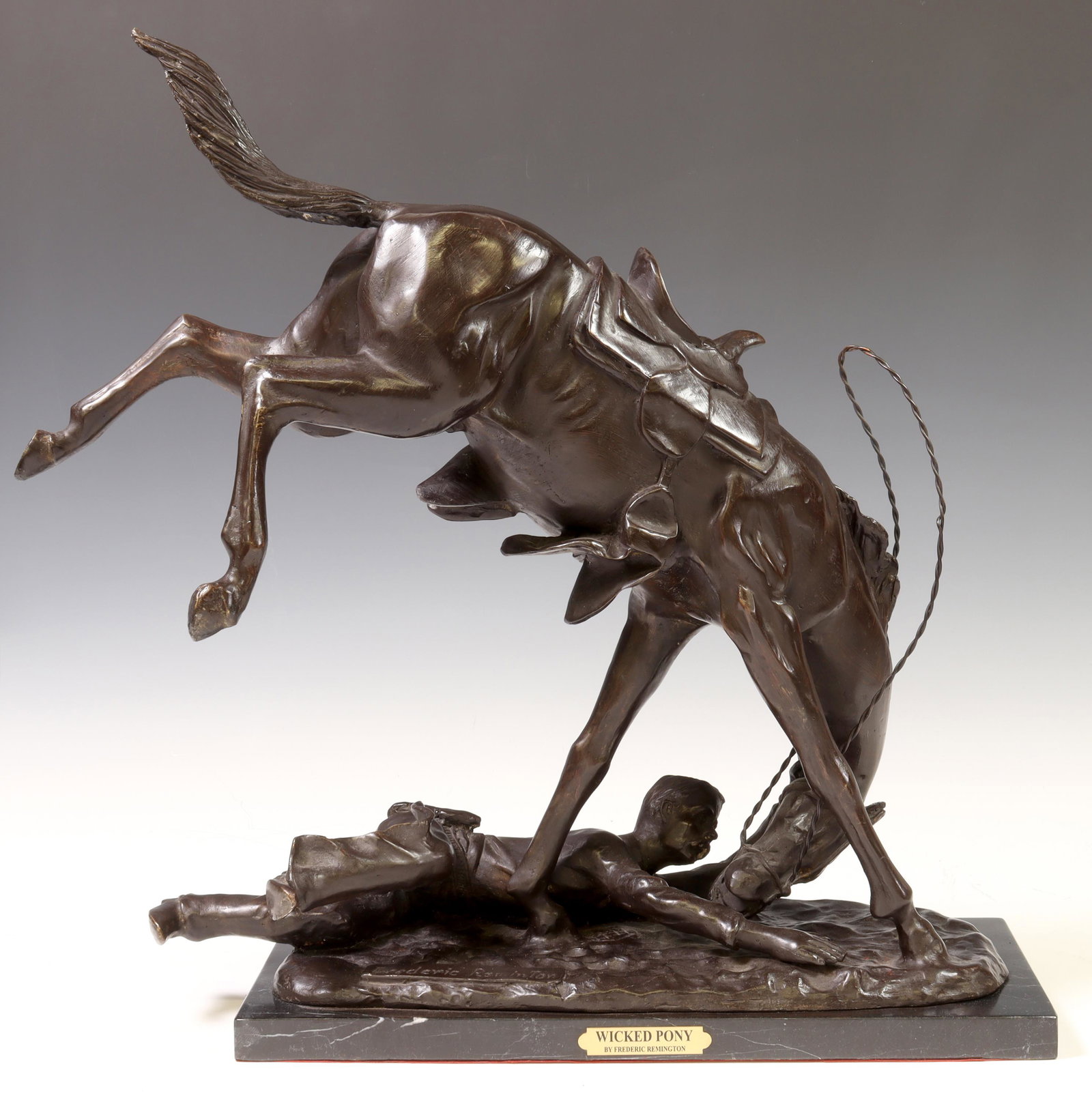 AFTER FREDERIC REMINGTON BRONZE, 'WICKED PONY': Patinated bronze sculpture, "Wicked Pony," after the original by Frederic Sackrider Remington (American, 1861-1909), rising on marble base, sculpture: approx 20.25"h, 19"w, 10.5"d, base: approx 1"h, 1