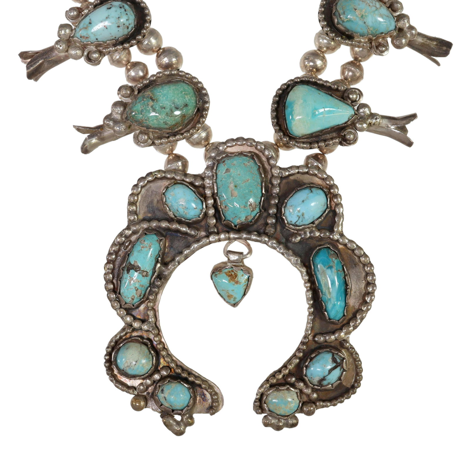 NATIVE AMERICAN TURQUOISE SQUASH BLOSSOM NECKLACE: Native American sterling silver squash blossom necklace, having ten blossoms, central naja pendant, all set with turquoise cabochons, double bench bead strands, ending in a single strand, hook closure