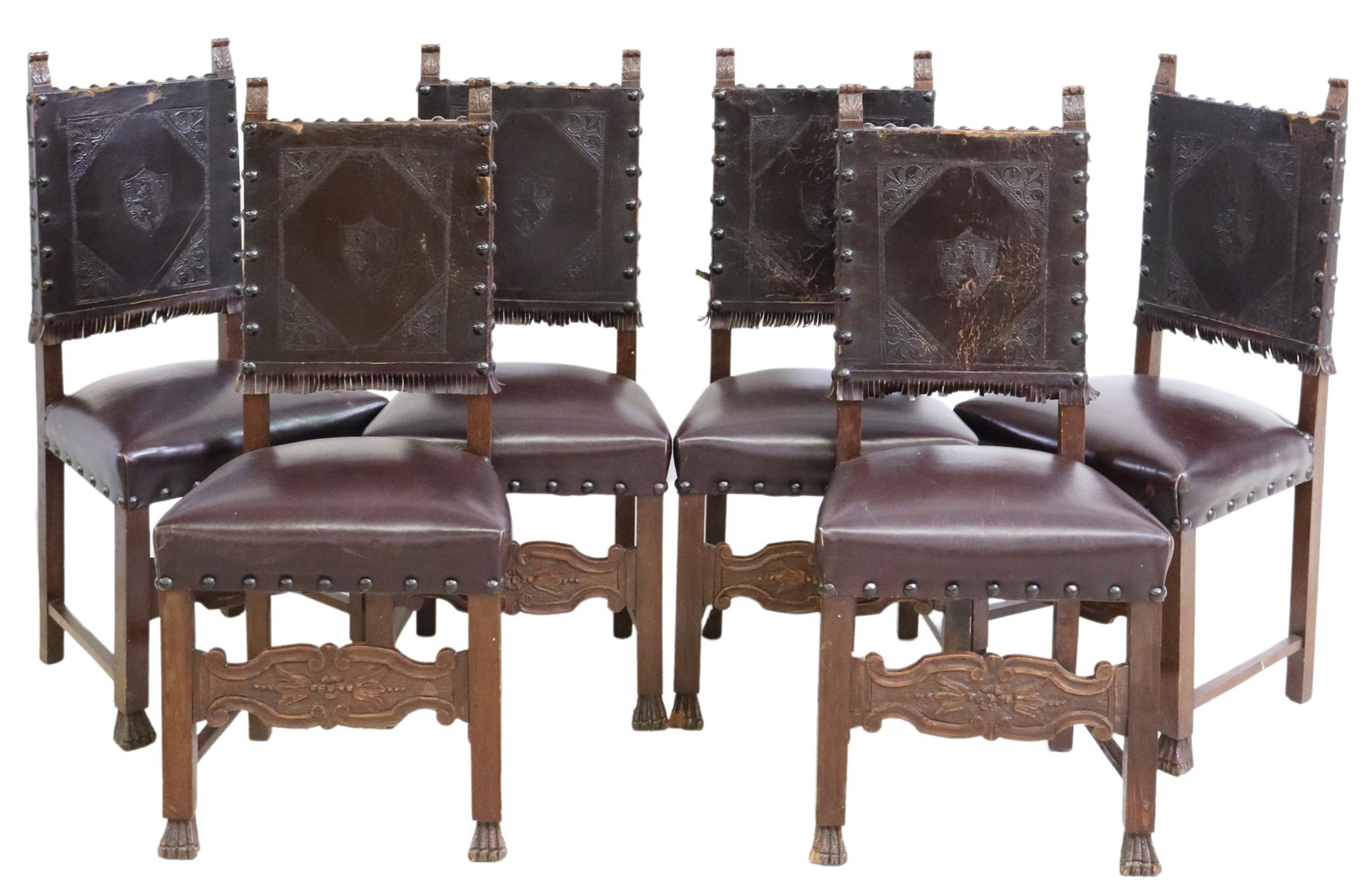 (6) BAROQUE STYLE EMBOSSED LEATHER DINING CHAIRS: (lot of 6) Baroque style dining chairs, late 19th c., embossed leather back with lion rampant, rising on stretcher-joined legs, ending in front paw feet, wear and loss to leather, approx 42"h, 19.75"w