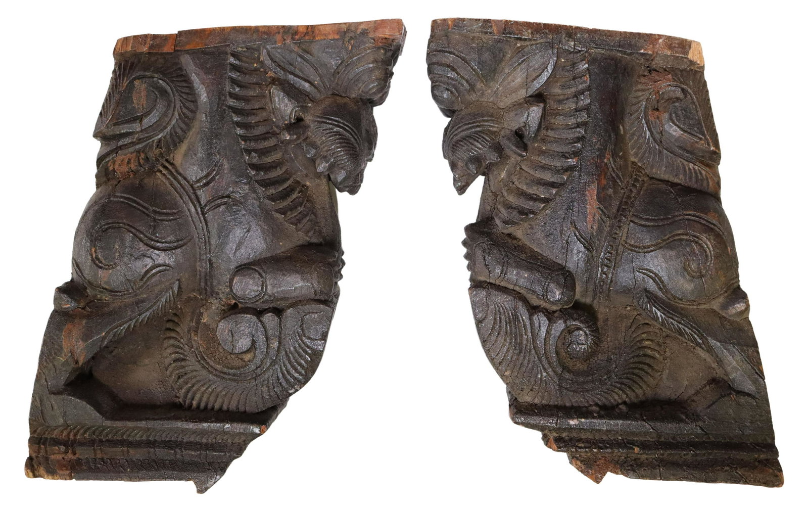 (2) ARCHITECTURAL WOOD TEMPLE BRACKETS, INDIA: (lot of 2) Architectural carved wood temple corbels/ brackets, India, approx 14"h, 3.75"w, 7.5"d; 16.25lbs total **Provenance: An important San Antonio, Texas estate** Start Price: $100.00