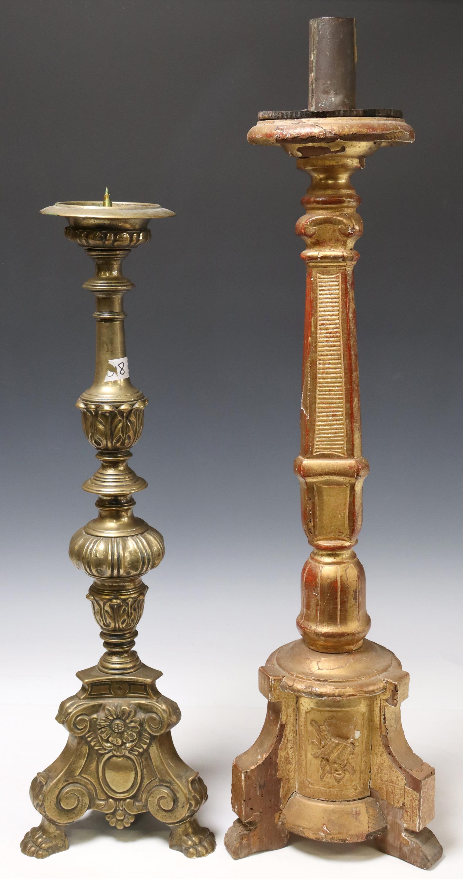 (2) BRONZE & GILTWOOD CHURCH ALTAR CANDLESTICKS: (lot of 2) Continental church altar candlesticks, late 19th c., including: (1) bronze candlestick, having turned form standard, rising on scrolled base, ending on paw feet, approx 24"h, 8"w, 8"d; (1) 