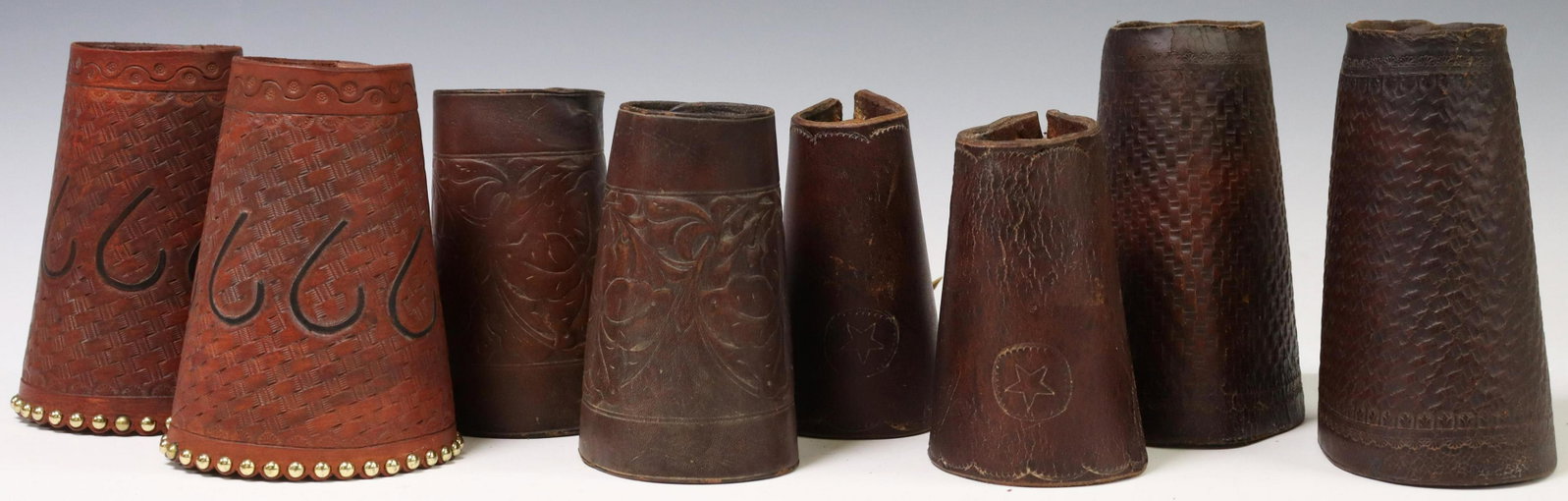 4) VINTAGE COWBOY TOOLED LEATHER CUFFS, 6666 RANCH: (lot of 4 pair) Vintage Cowboy western tooled leather cuffs: (1) pair, signed Jay Nunn, Miles City, Montana, tooled "6666" over basket weave pattern, silver tone studs, leather lace, snap buttons, app