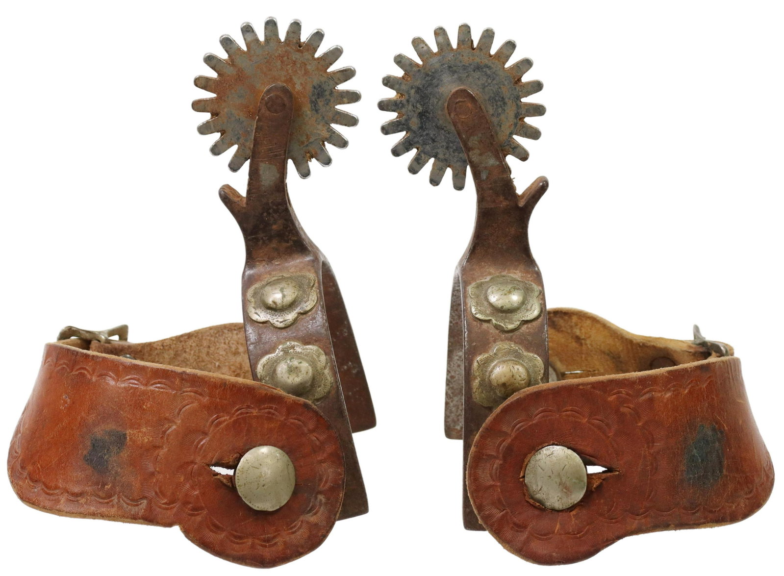 WESTERN CROCKETT BLOSSOM PATTERN COWBOY SPURS: (pair) Western steel spurs, marked Crockett, outside heelband with silver-tone metal blossoms, 2.25" rowels, twenty points, worn tooled leather straps, yoke: approx 3 3/8"w, 3.25"d, 1.75lbs total Star