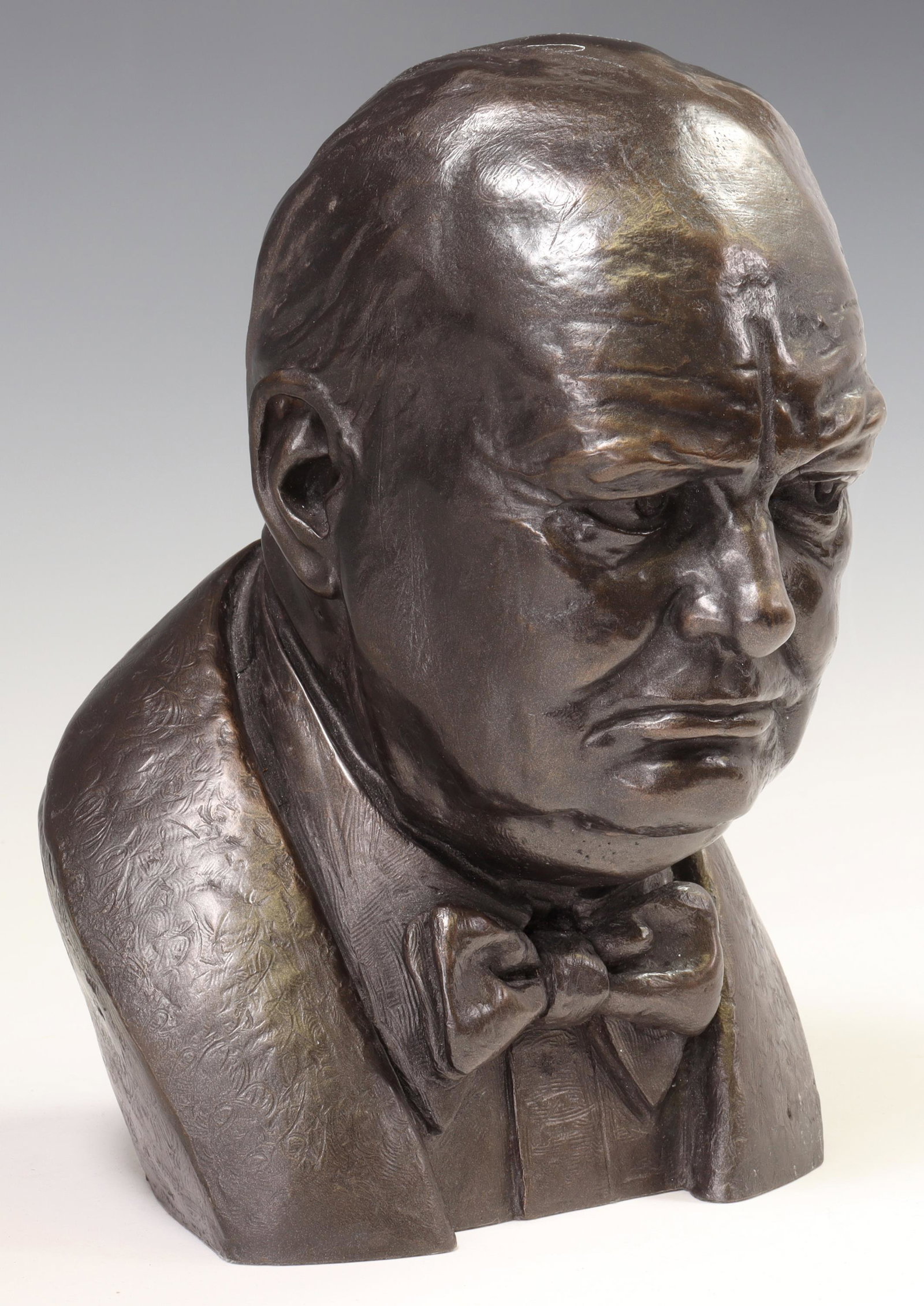 COLD-CAST RESIN BRONZE BUST OF WINSTON CHURCHILL: Cold-cast resin bronze bust of Winston Churchill (British, 1874-1965), signed in cast J. Williams (Joseph Williams, 20th c.), dated [19]78, approx 11"h, 8"w, 8.25"d, 13.75lbs Start Price: $200.00