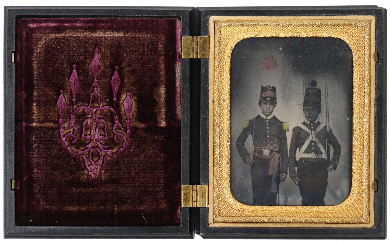 DAGUERREOTYPE QTR PLATE TWO ARMED SOLDIERS: Daguerreotype quarter plate photograph depicting two young men in military uniforms, possibly military school cadets, one with shako hat and holding a musket, the other holding a sword, likely an offi