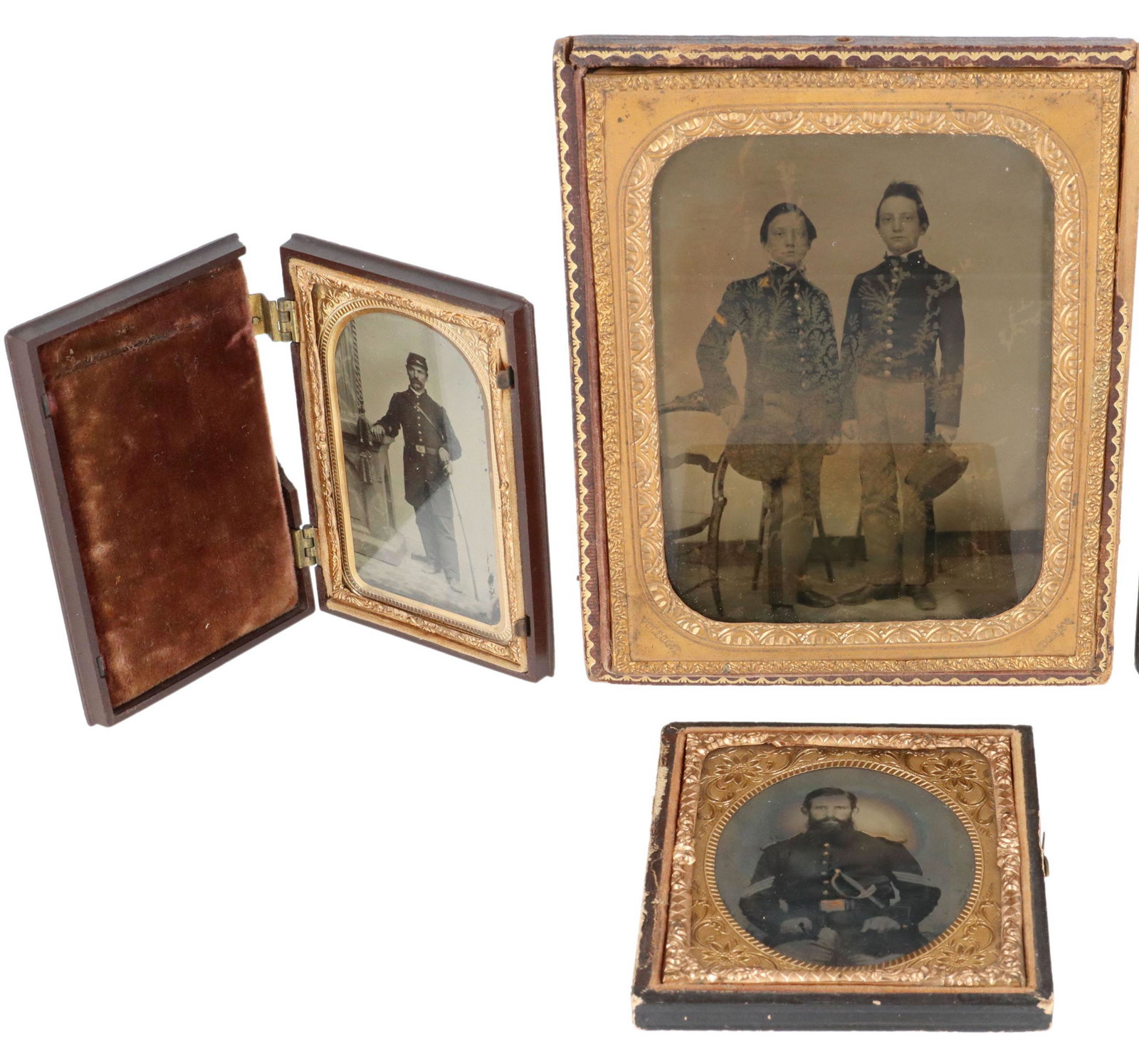 (3) CIVIL WAR TINTYPE, AMBROTYPE, SOLDIERS, CADETS: (lot of 3) Civil War images: (1) tintype, a formal photo of a Union officer with kepi, greatcoat and sword; (1) tintype, a seated soldier holding a sword partially drawn from its' scabbard; (1) ambrot