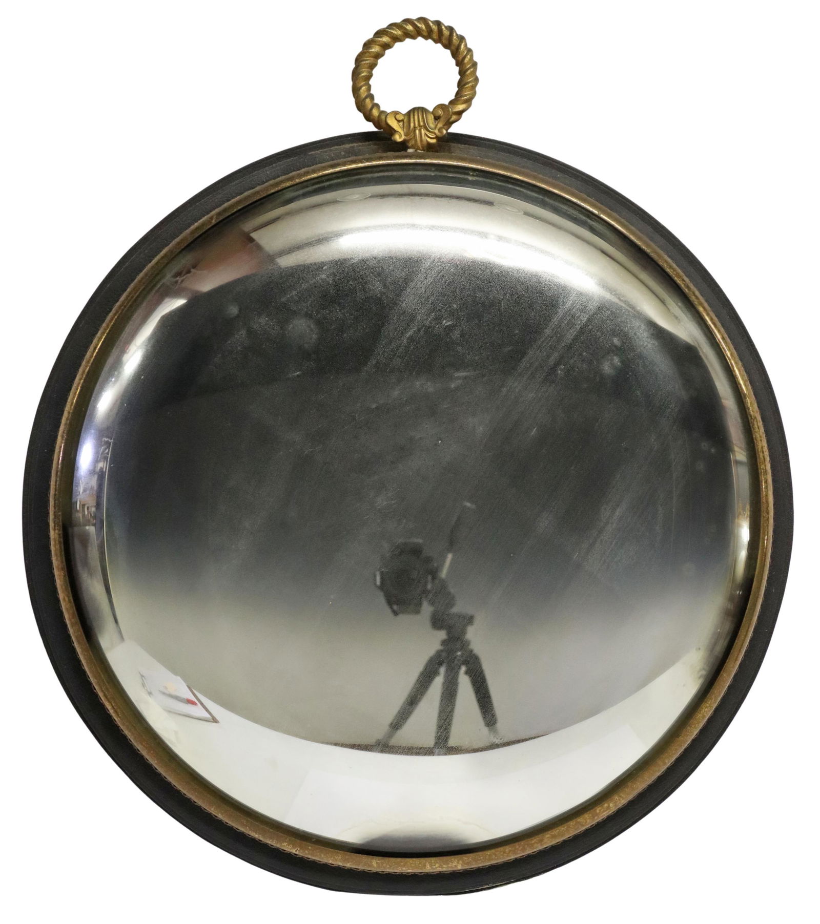 FRENCH GILT METAL & LEATHER CONVEX WALL MIRROR: French gilt metal convex sorciere wall mirror, Orphea, having top rope design handle, over round leather-clad backplate, foliate metal border, encasing convex mirror plate, approx 15.75"h, 13 5/8"diam