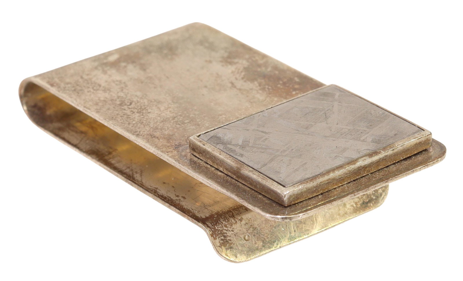 METEORITE STERLING SILVER MONEY CLIP: Meteorite money clip, having an approx 5.8" x .75" framed Gibeon meteorite piece affixed to one side of the sterling silver clip Start Price: $60.00