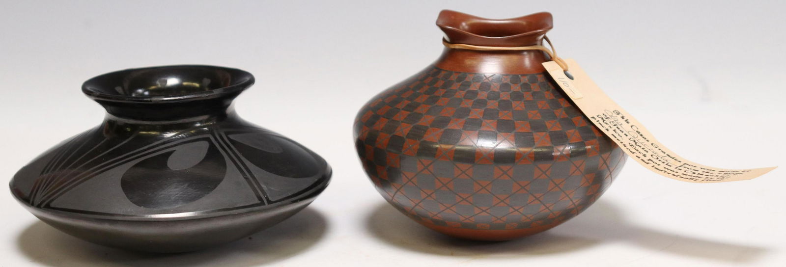 (2) MATA ORTIZ SIGNED POTS REYNALDO & OLGA QUEZADA: (lot of 2) Mata Ortiz pottery, Chihuahua, Mexico: (1) blackware vase or jar signed Reynaldo Quezada, approx. 2.5"h, 5.5"diam; (1) diamond pattern pot tagged made by Olga Quezada, approx. 3.75"h, 4.75"