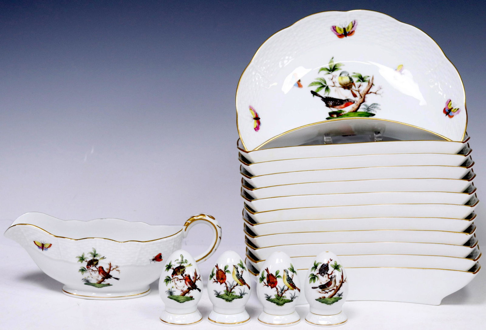 (17) HEREND 'ROTHSCHILD BIRD' PORCELAIN TABLEWARE: (lot of 17) Hungarian porcelain tableware, Herend, 20th c., in the "Rothschild Bird" pattern, having parcel gilt trim, various hand-painted bird and insect motifs, each with maker's mark underfoot, in
