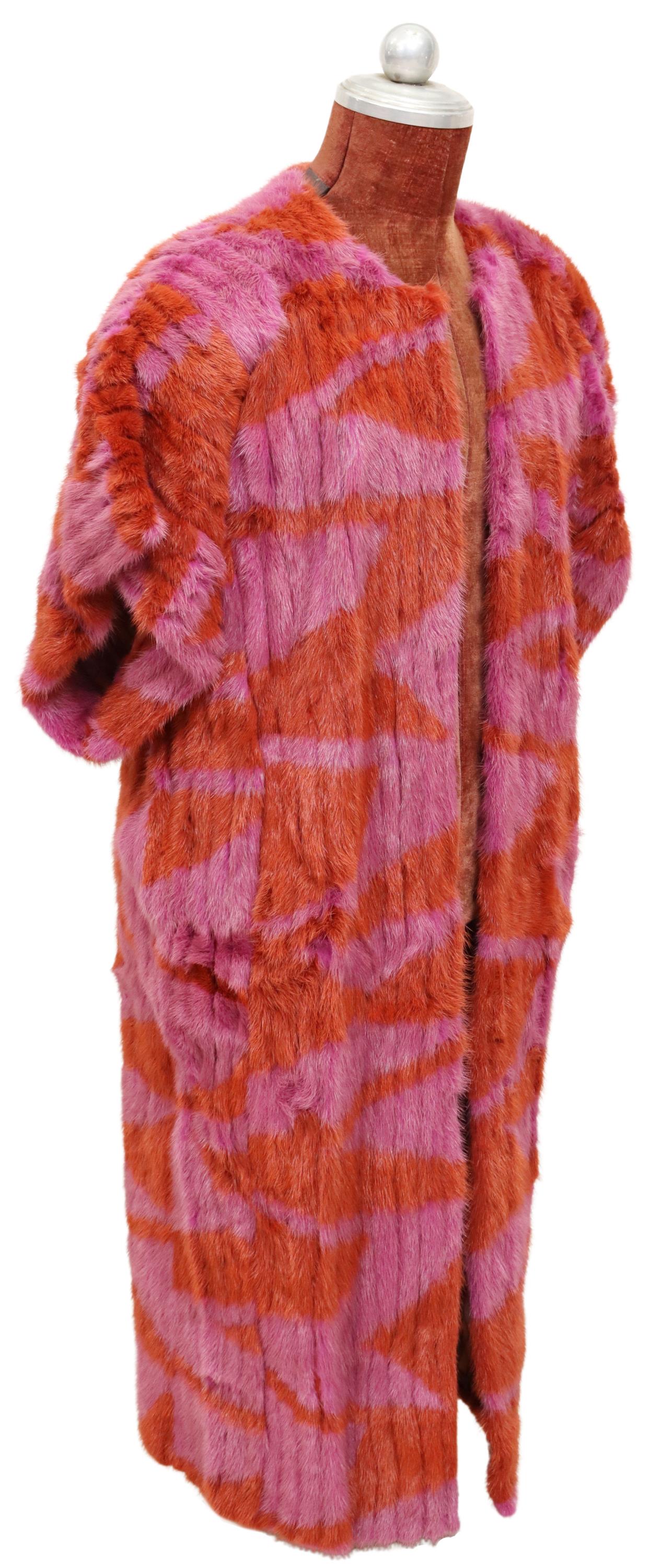 VINTAGE LADIES FURRYTALE PINK & RED DYED FUR COAT: Vintage ladies dyed fur coat, Furrytale Design Team Ulla, Finland, having pink and red patterned exterior, padded short sleeves, dual side pockets, open front, revealing striped suede and leather lini