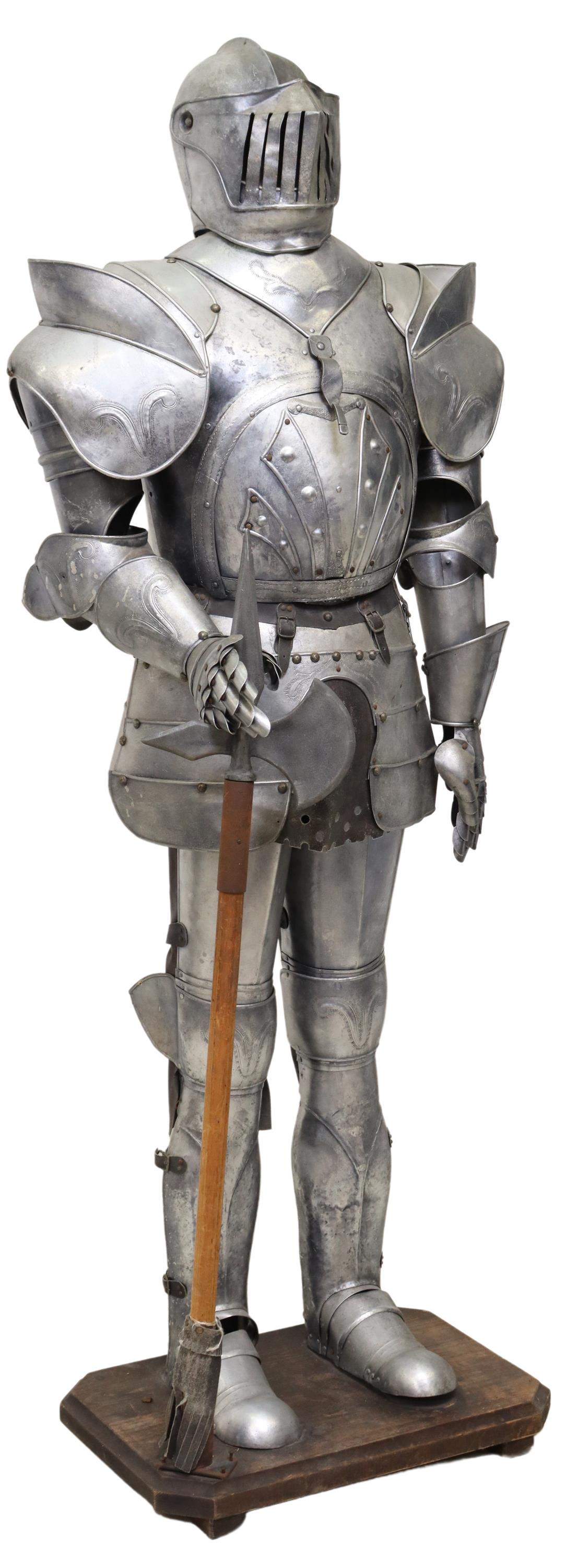 LIFE-SIZE REPLICA SUIT OF ARMOUR BAR & DRINK SERVER, 74"H: Life-size metal replica suit of plate armour, 20th c., hinged breastplate opens to reveal small bar shelf and drinks tray, standing on a wood plinth, some denting, approx 74"h Start Price: $400.00