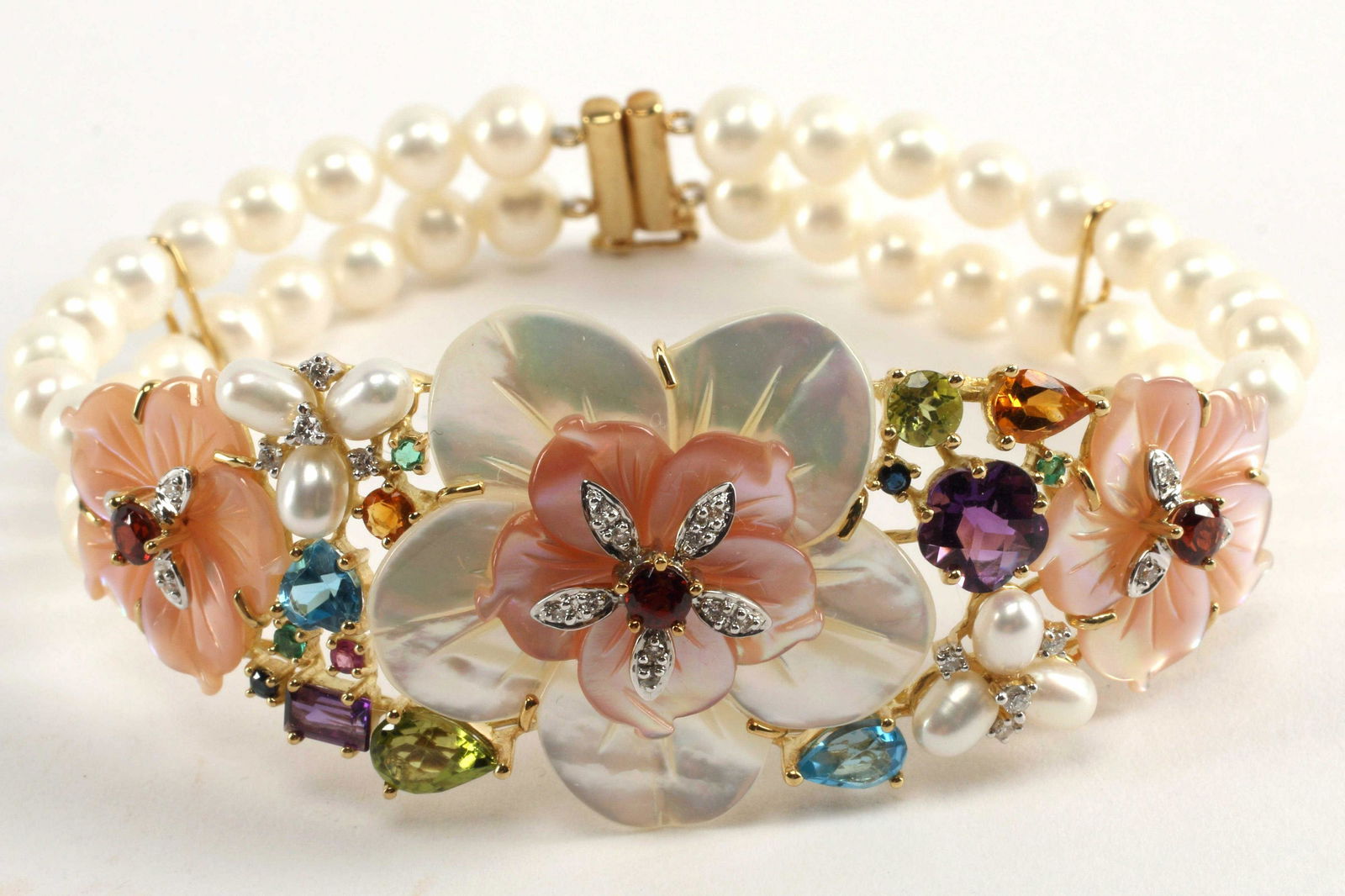 ESTATE 18KT GOLD PEARL & MULTI-GEMSTONE BRACELET: Estate 18kt yellow gold pearl, mother-of-pearl, diamond, and multi-gemstone bracelet, hallmarked 18K 750, approx 7.25"l, 28.3 grams (inclusive of all materials) Start Price: $425.00
