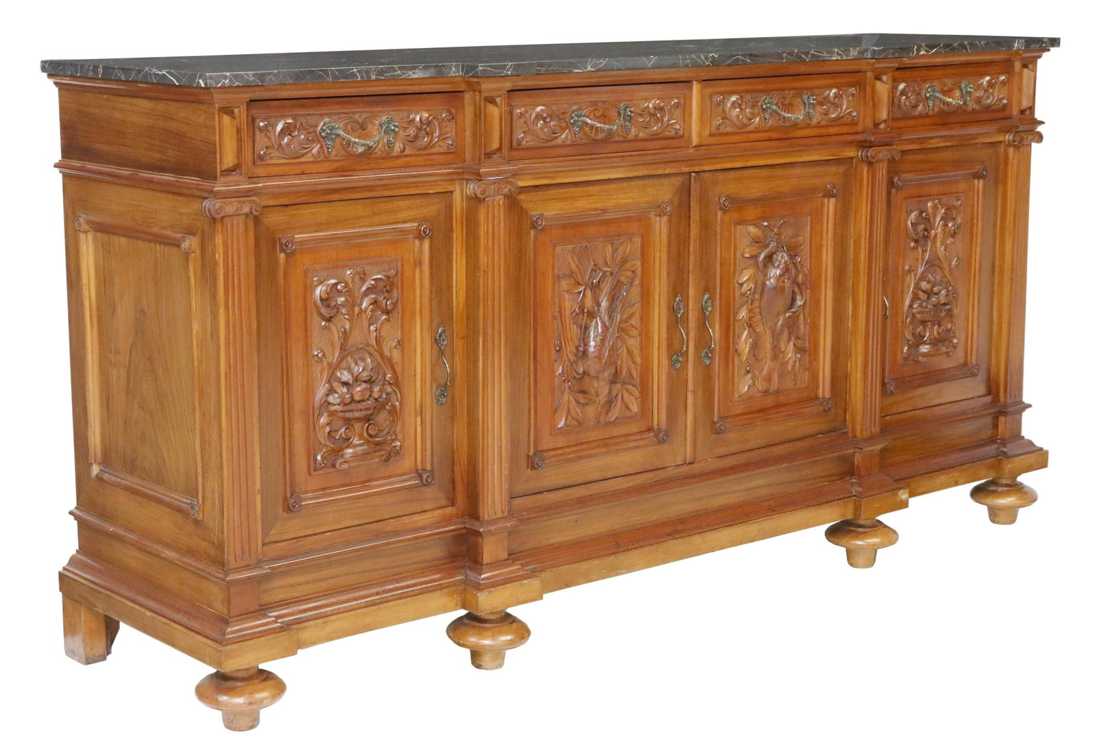 CONTINENTAL CARVED WALNUT MARBLE-TOP SIDEBOARD: Continental carved walnut marble-top sideboard, early 20th c., case fitted with four drawers, over four cabinets, carved with game birds and foliated urns, flanked by fluted side supports, rising on l
