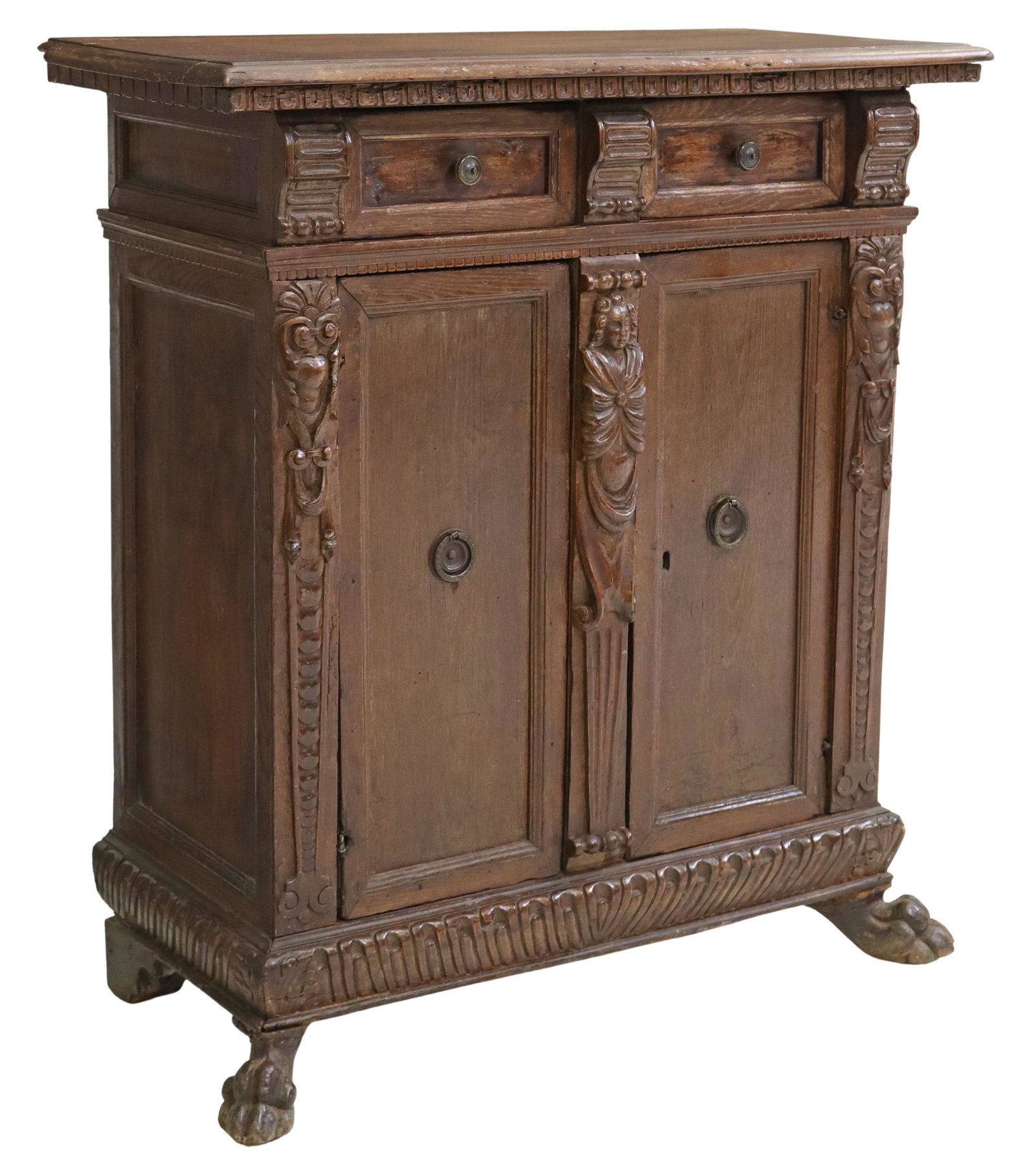 ITALIAN CARVED CREDENZA/ CUPBOARD, 18TH C.: Italian carved credenza/ cupboard, 18th c., two drawers, over two cabinet doors separated by a figural pilaster, interior shelf, rising on lion paw feet, approx 38.75"h, 35.25"w, 16.5"d Start Price: $
