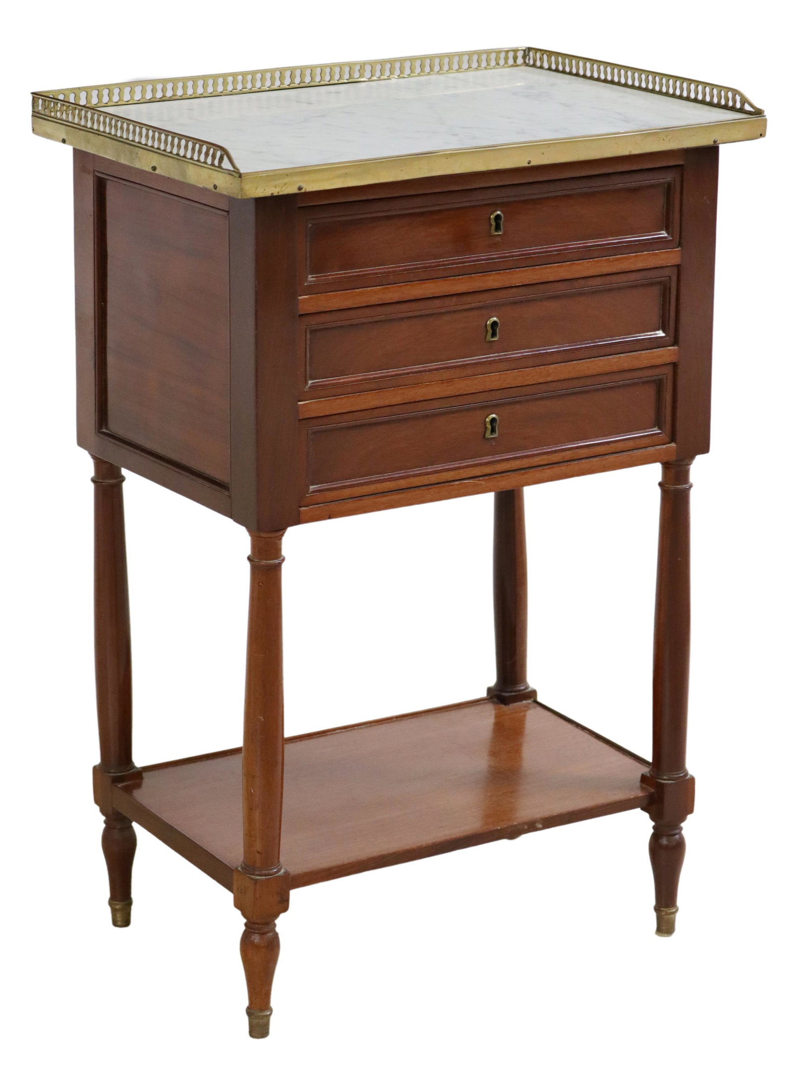 LOUIS XVI STYLE MARBLE-TOP MAHOGANY NIGHTSTAND: French Louis XVI style mahogany nightstand, early 20th c., having pierced gilt metal gallery, encasing rectangular marble top, over three drawers, rising on tapered supports, joined by medial shelf, e