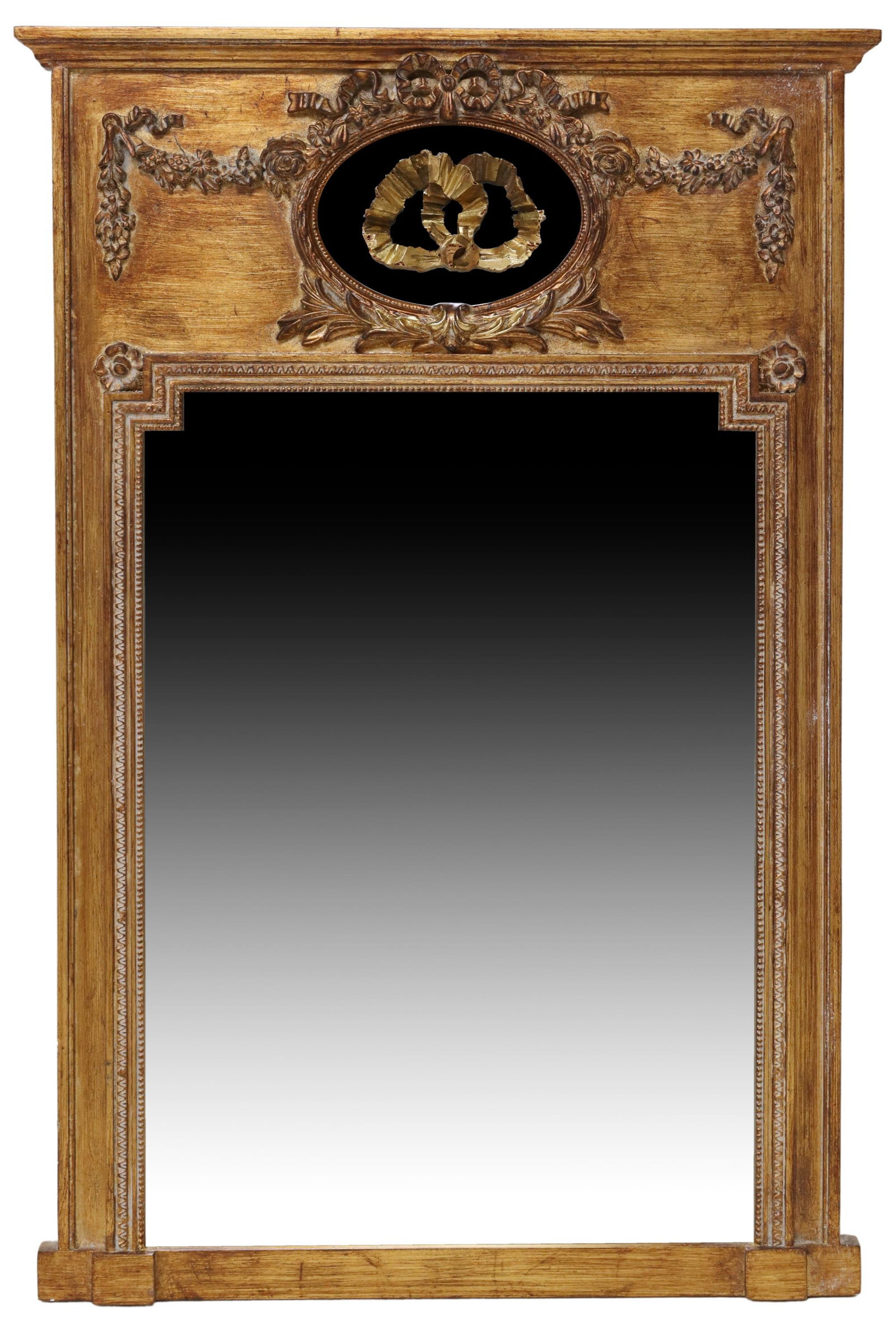 FRENCH LOUIS XVI STYLE PARCEL GILT TRUMEAU MIRROR: French Louis XVI style parcel gilt trumeau mirror, 20th c., having molded cornice, swag and bow centering top oval mirror, over shaped frame encasing flat mirror plate, approx 41.5"h, 27 7/8"w, 19.5lb
