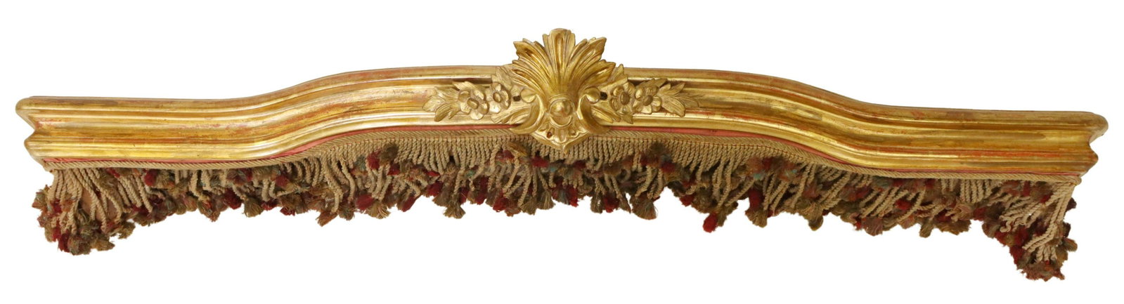 LOUIS XV STYLE GILTWOOD VALENCE/ PELMET: Louis XV style architectural giltwood valence/ pelmet, 19th c., having foliate crest, hung with worn rope tassels, approx 8"h, 64.25"w, 12.75"d Start Price: $150.00