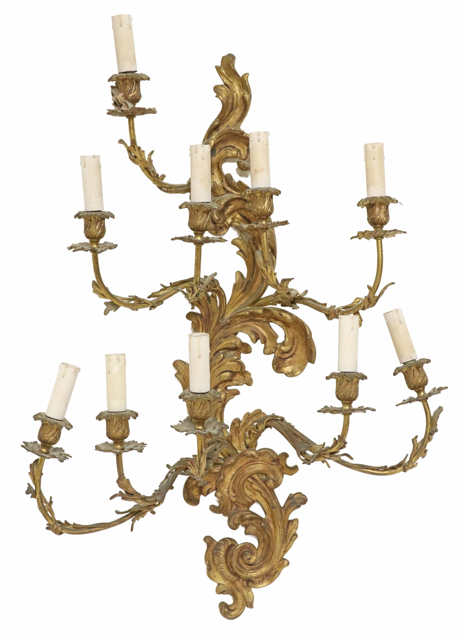 LOUIS XV STYLE BRONZE 10-LIGHT WALL SCONCE: Louis XV style bronze ten-light wall sconce, 20th c., having rocaille back plate, issuing foliated arms and bobeches, in need of wiring, approx 30.75"h, 22.5"w, 8.75"d, 17lbs Start Price: $150.00