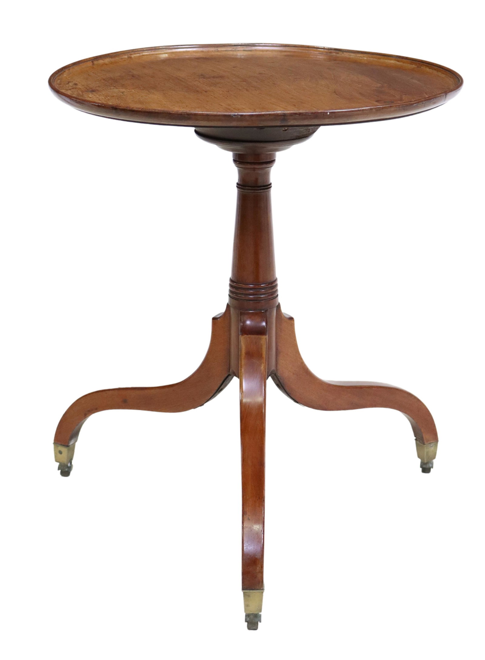 HEPPLEWHITE STYLE CIRCULAR TRIPOD SIDE TABLE: Hepplewhite style side table, 20th c., having circular top, over turned form standard, rising on tripod base, ending on castors, approx 27"h, 23.25"diam Start Price: $100.00