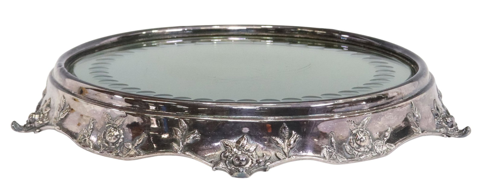 AMERICAN SILVERPLATE ROUND MIRROR TABLE PLATEAU: American silverplate surtout de table/ table plateau, Queen City Silver Company, Cincinnati, Ohio, early 20th c., encasing mirror plate with raised under glass accents, over rose repousse and scallope
