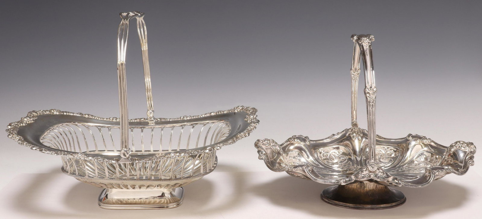 (2) ENGLISH & OTHER SILVERPLATE CAKE BASKETS: (lot of 2) Silverplate brides baskets/ cake baskets, including: (1) Barker Brothers, Birmingham, with floral design in relief, (1) unmarked, with openwork sides, largest: approx 5"h, 13.5"l, 11.5"w; 5