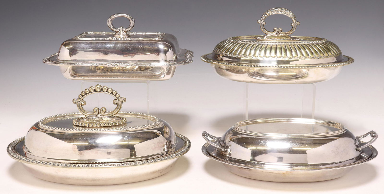 (4) SILVERPLATE COVERED VEGETABLE DISHES: (lot of 4) Silverplate covered vegetable dishes, including: (1) Meriden Silver Plate Company, (1) Friedman Silver Company, retailed by Herzog Galleries, Houston, (1) partially illegible initial mark,