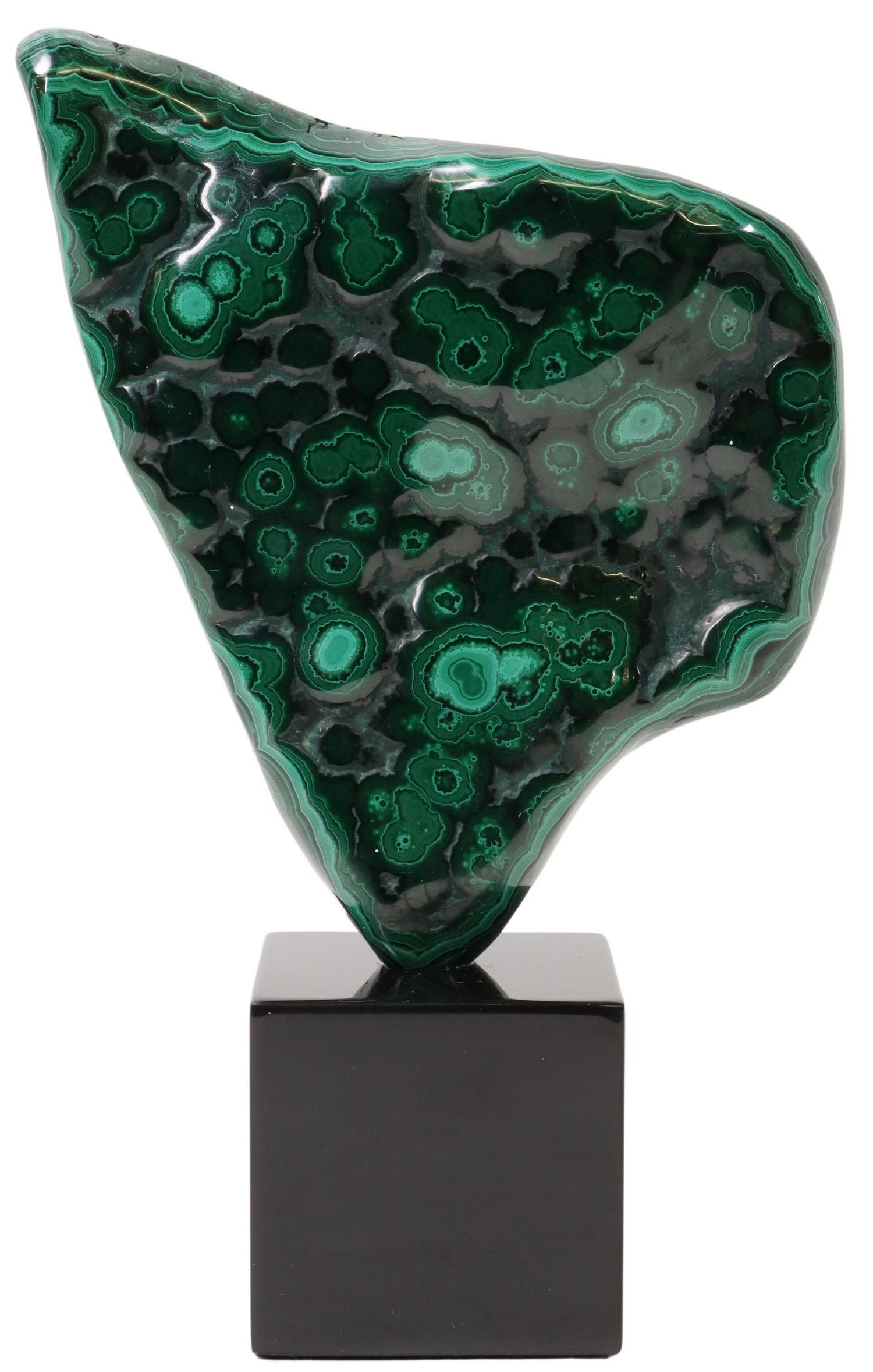 GEOLOGICAL MALACHITE SPECIMEN ON BLACK MARBLE BASE: Polished malachite specimen, mounted on black marble base, specimen: approx 7"h, 5.25"w, 1.5"d, overall: approx 9"h, 5.25"w, 3"d, 3.8lbs Start Price: $150.00